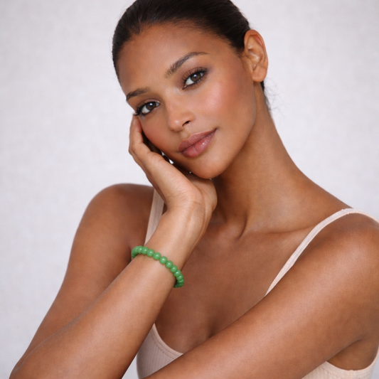 Model wearing emerald green jade bracelet close up