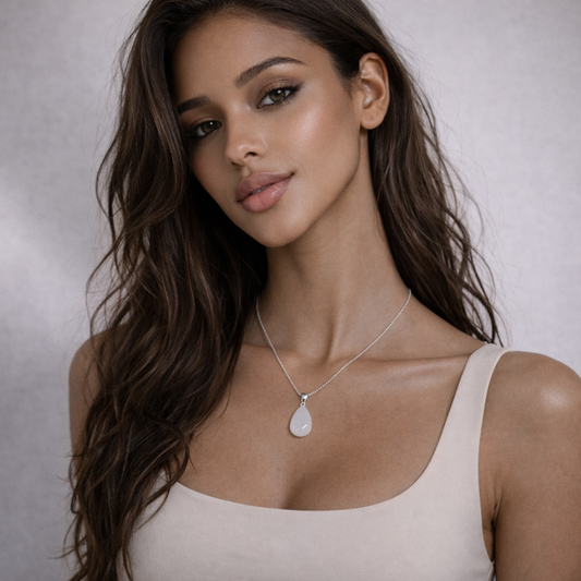 Moonstone necklace worn on model with beige top and silver chain
