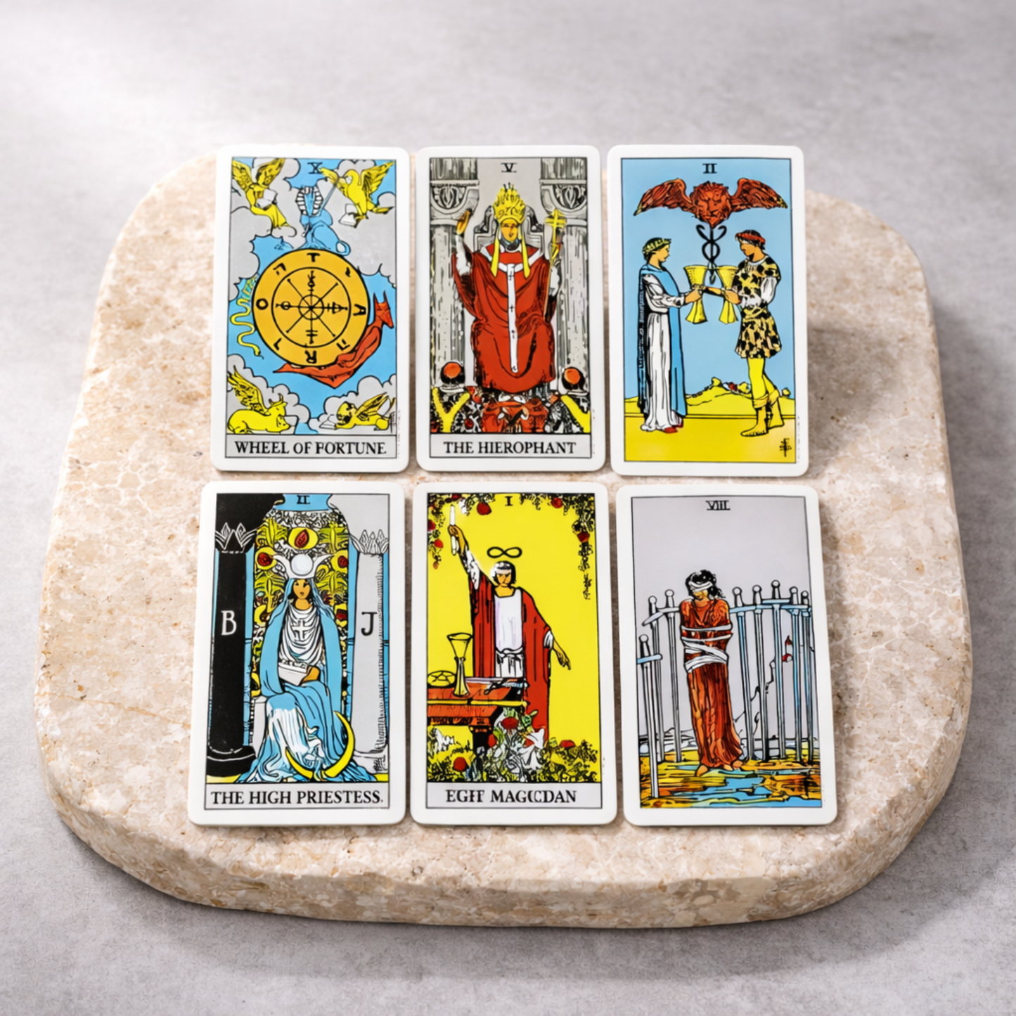 Rider Waite tarot cards laid out on stone