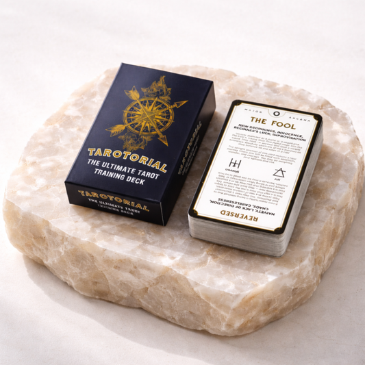 Tarotorial tarot training deck box and card stack on beige stone slab