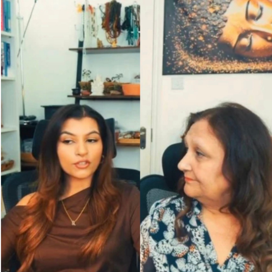 Two women in a podcast studio in split-screen, speaking and facing each other with a microphone visible and shelves in the background