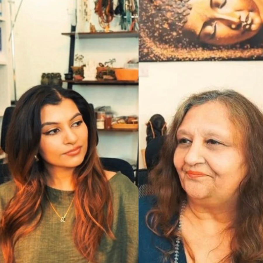 Two women in a podcast studio in split-screen, facing each other in conversation with warm lighting and shelves in the background