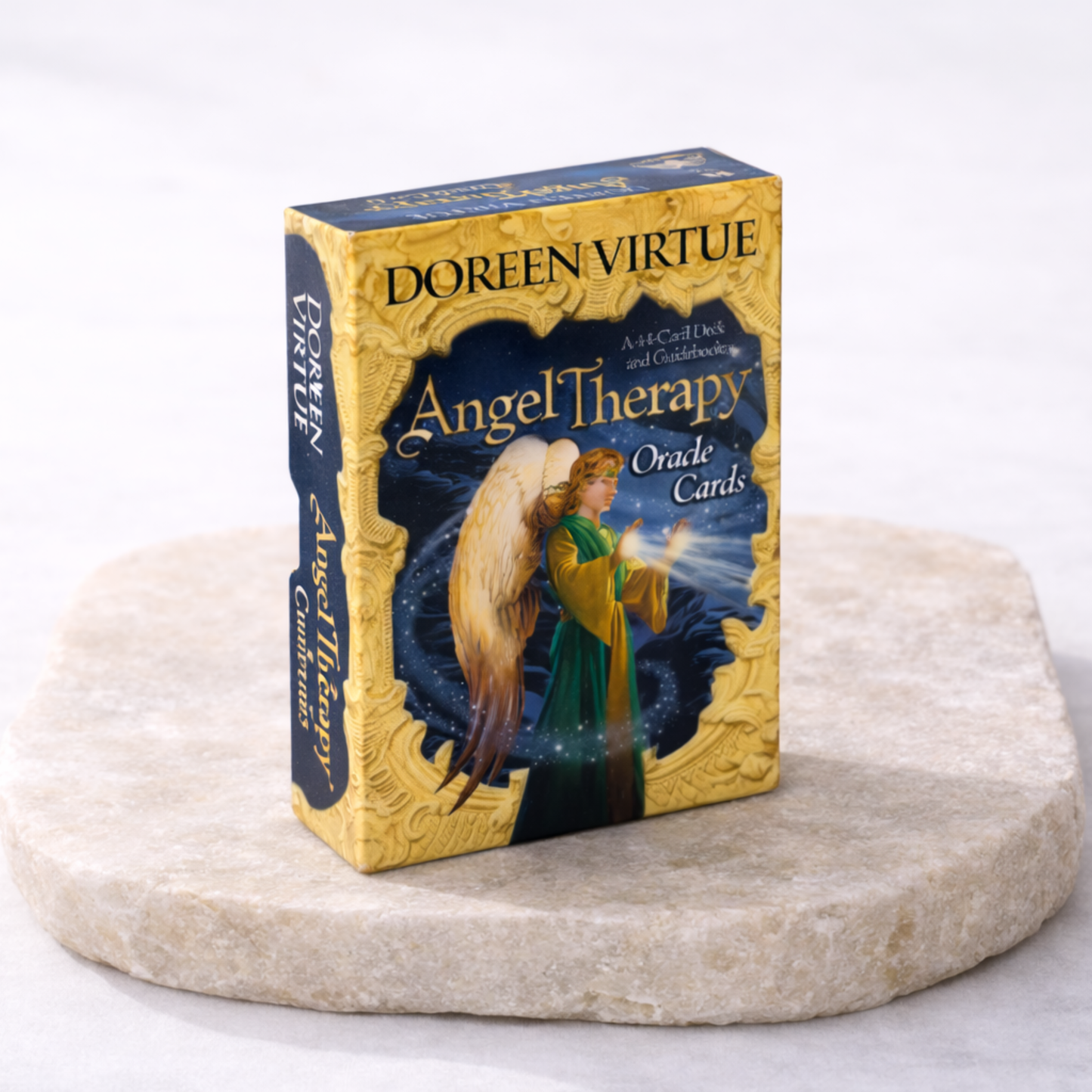 Angel oracle cards box Doreen Virtue Angel Therapy oracle cards on beige stone slab