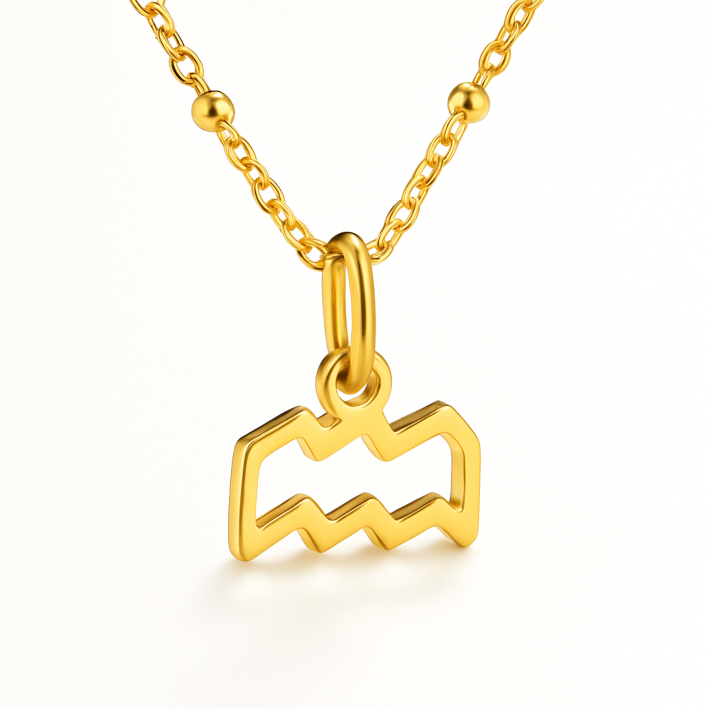 Aquarius gold plated necklace close up showing gold zodiac symbol pendant
