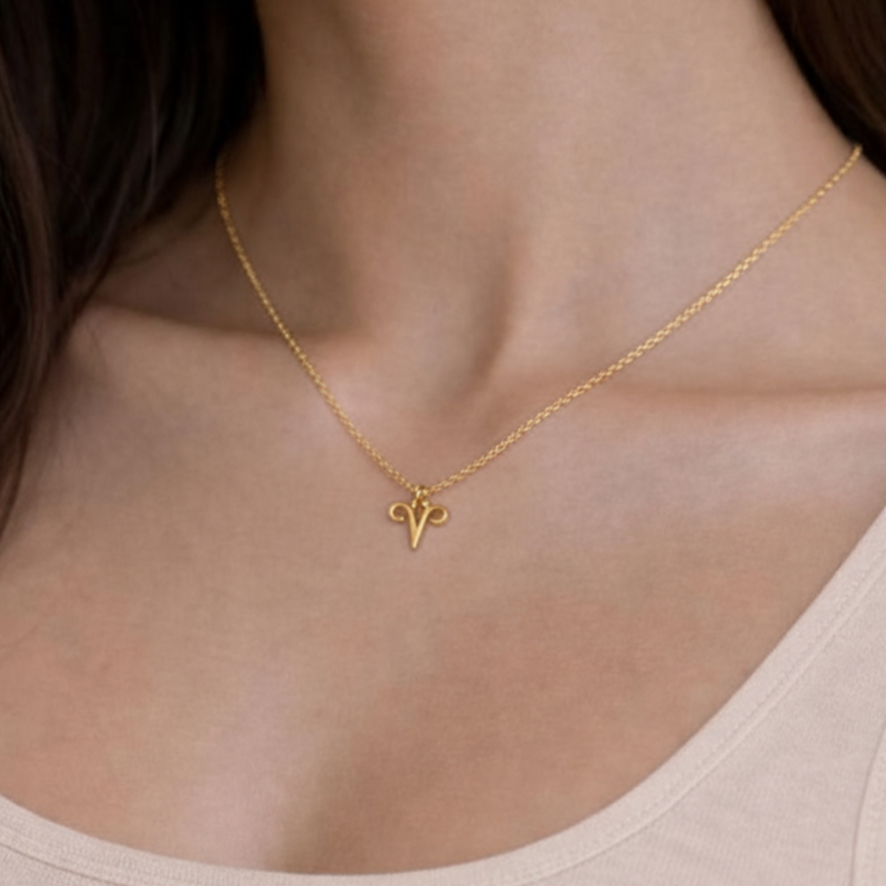 Aries necklace gold close up showing zodiac symbol pendan