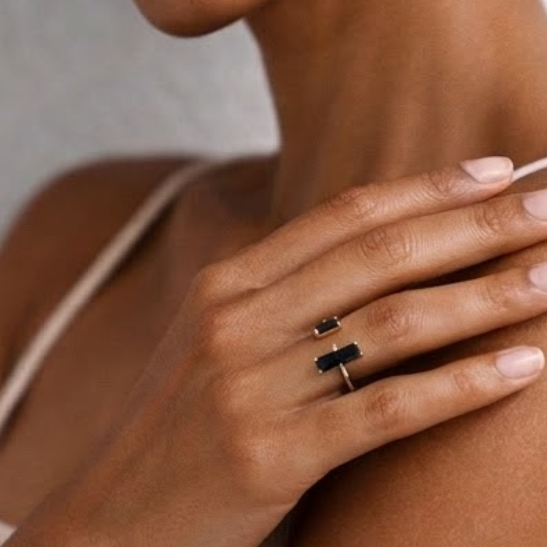 Black obsidian ring close up on hand