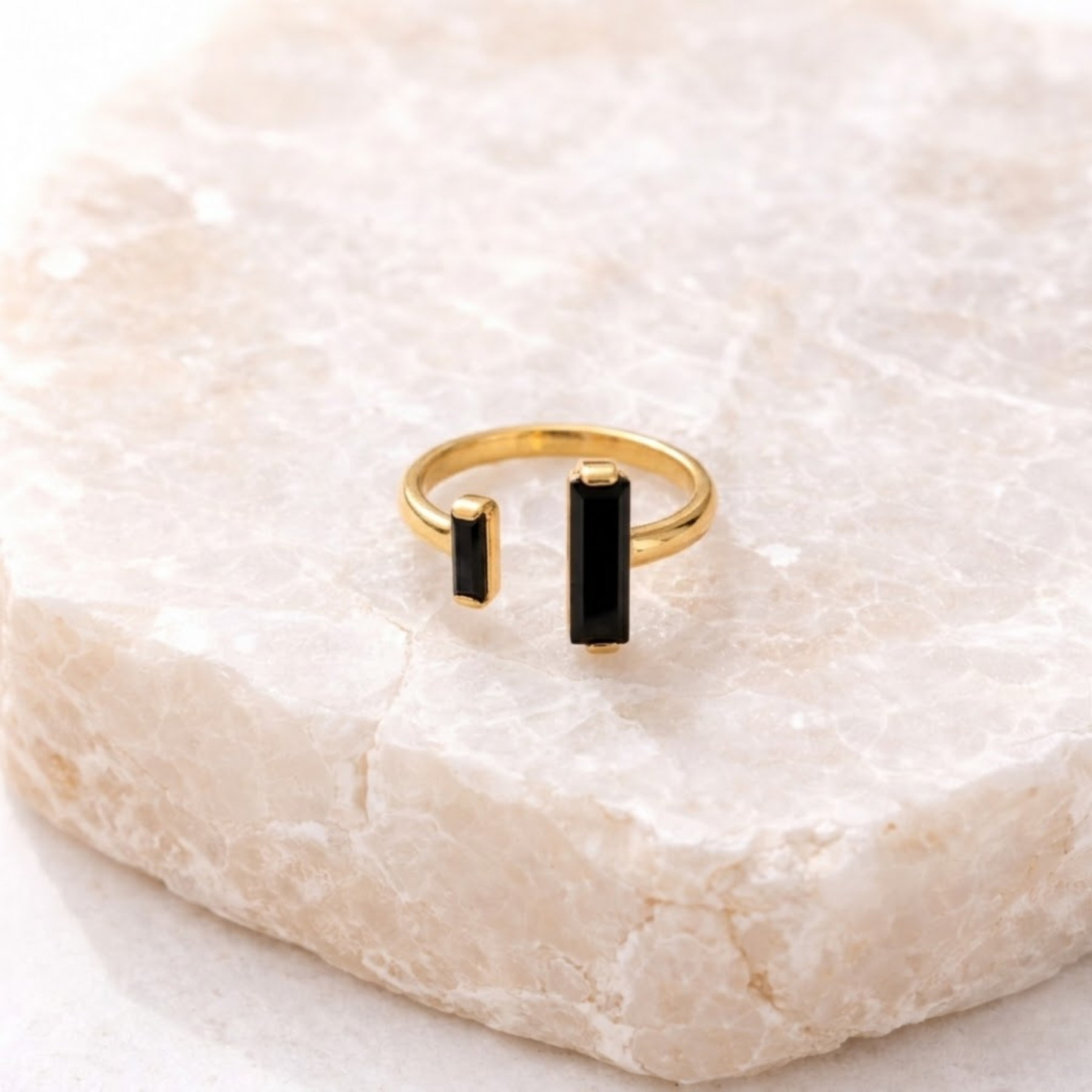 Black obsidian ring on stone display