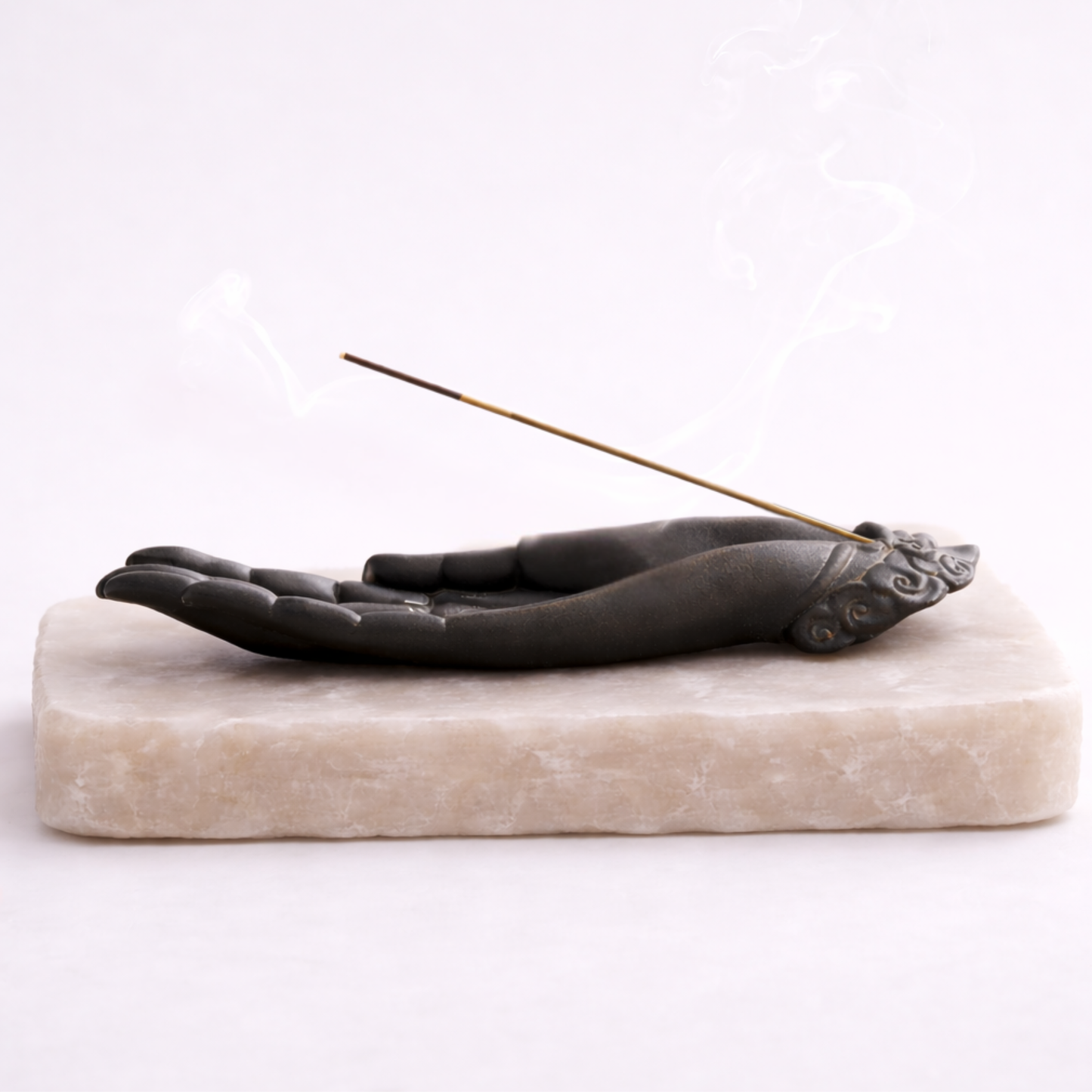 Buddha hand incense burner horizontal view with incense smoke