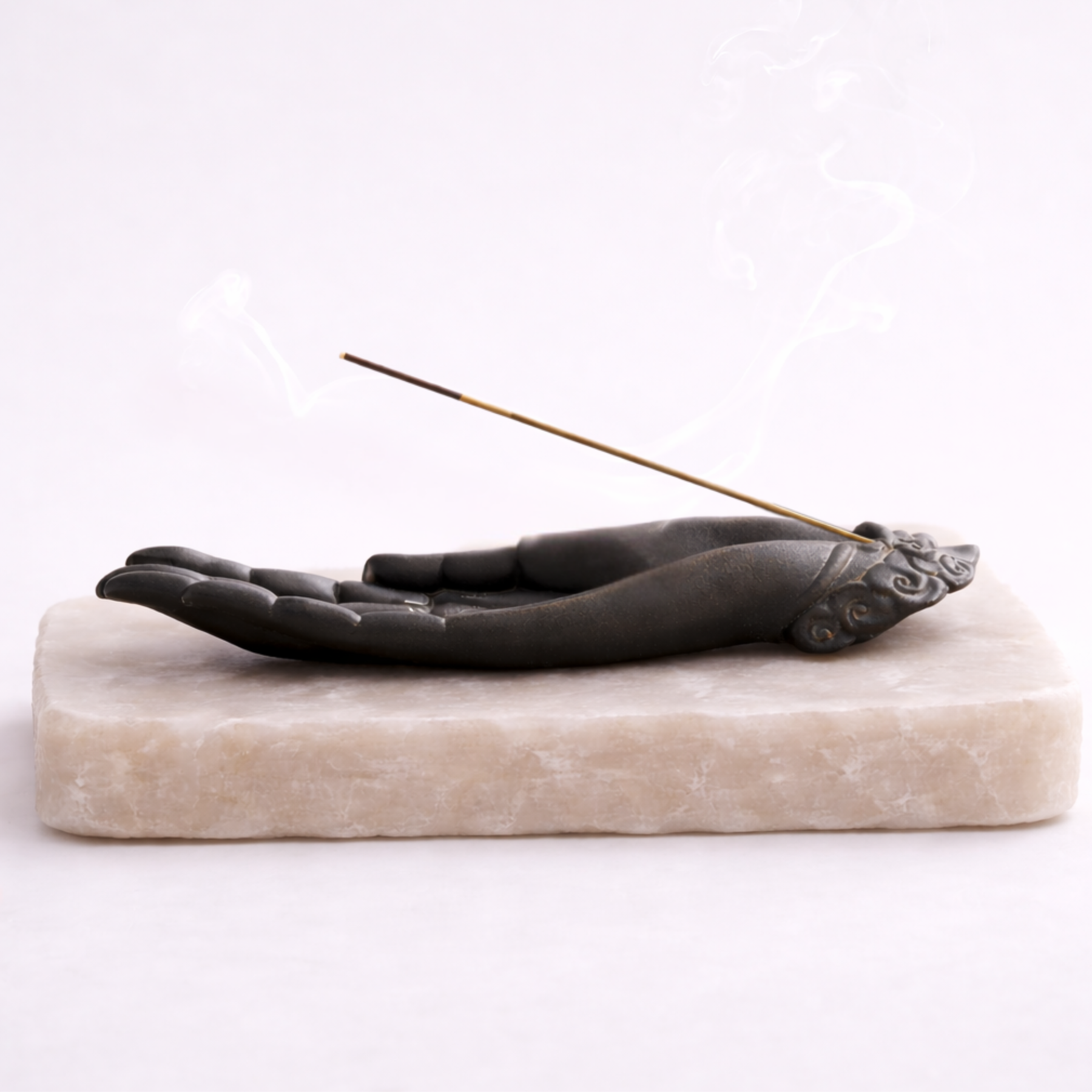 Buddha hand incense burner horizontal view with incense smoke