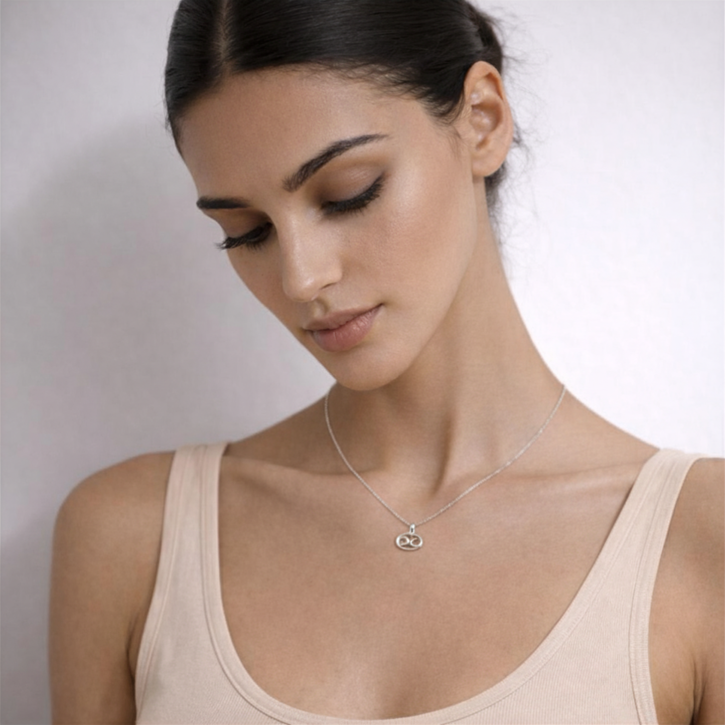 Cancer zodiac necklace silver close up showing zodiac symbol pendant