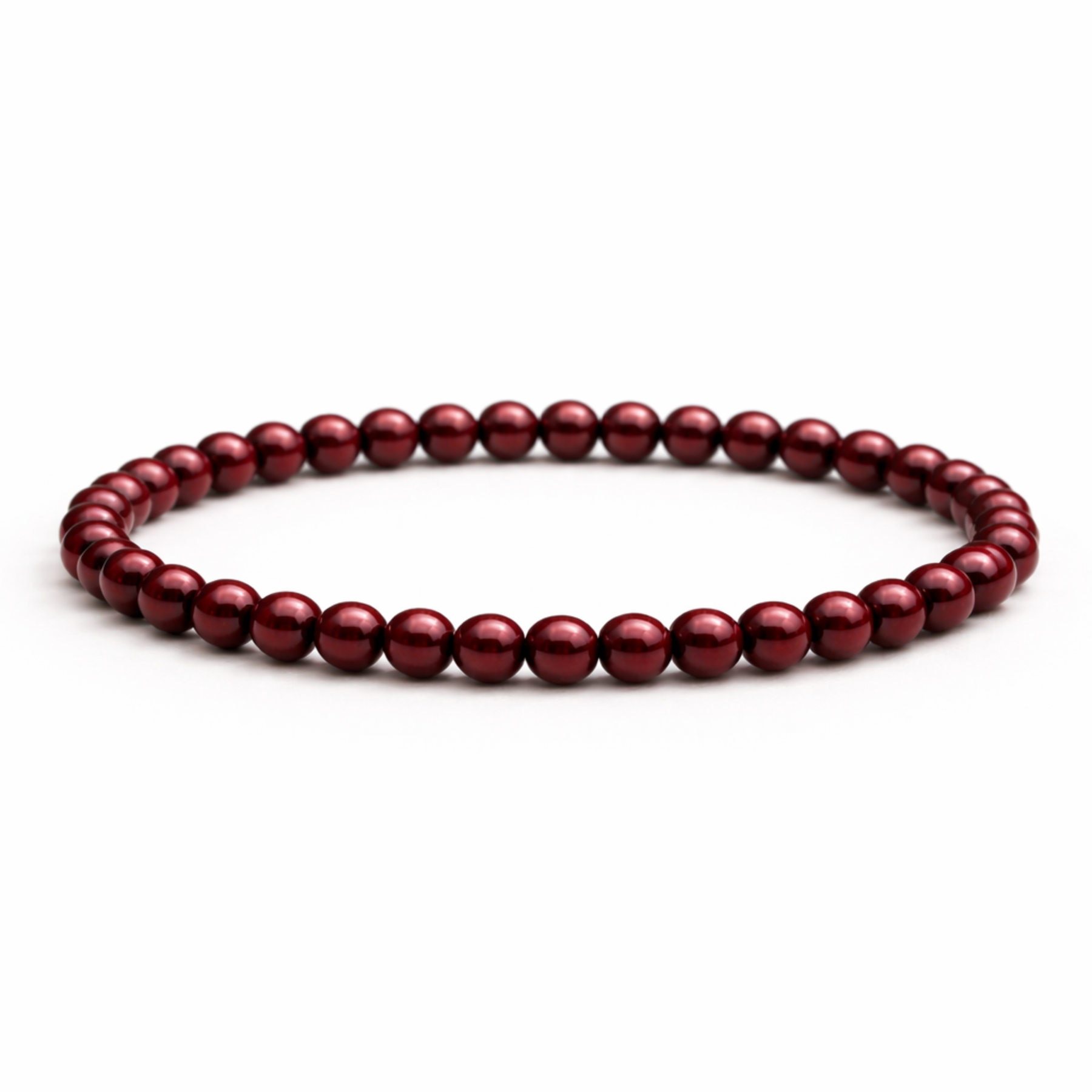 Cinnabar crystal bracelet with round polished red beads on white background