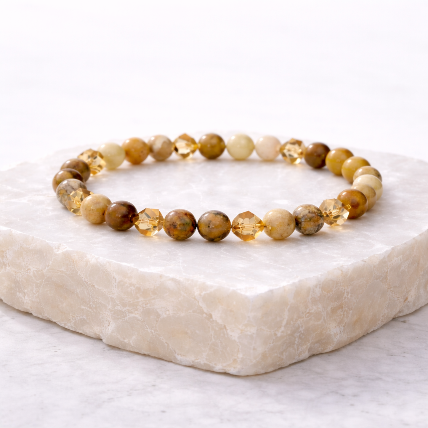Citrine crystal bead bracelet with gold accent beads on stone base