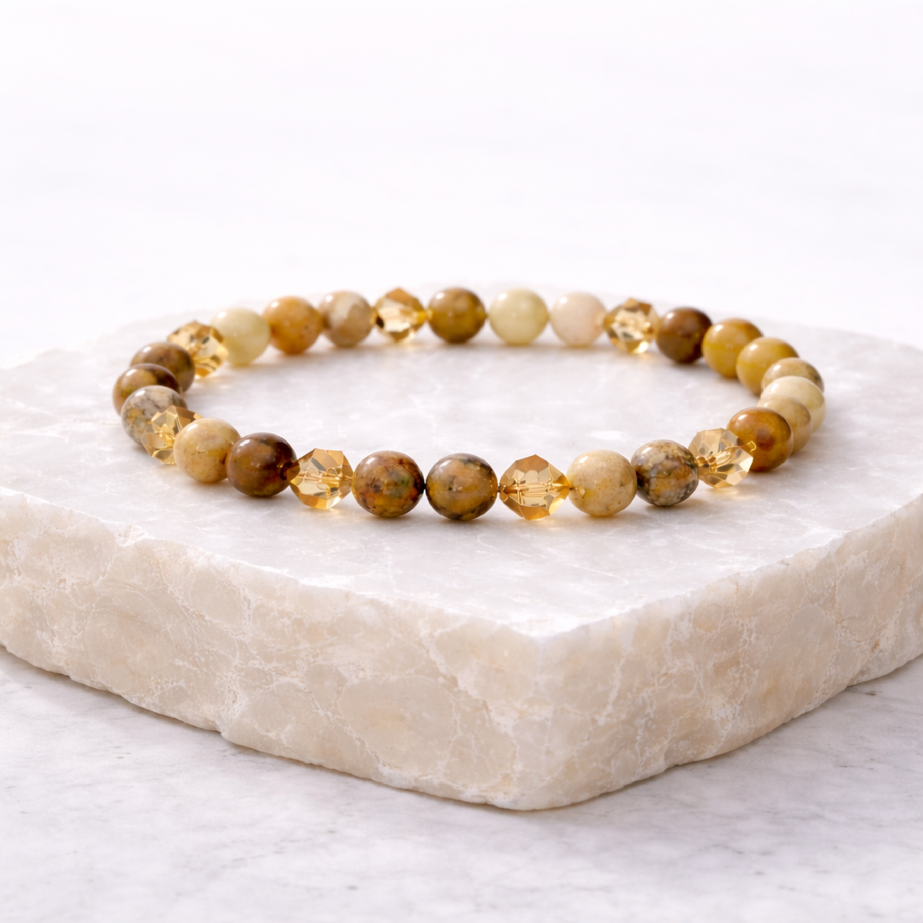 Citrine crystal bead bracelet with gold accent beads on stone base