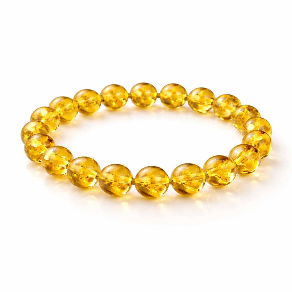 Citrine crystal bead bracelet with round yellow gemstone beads on white background