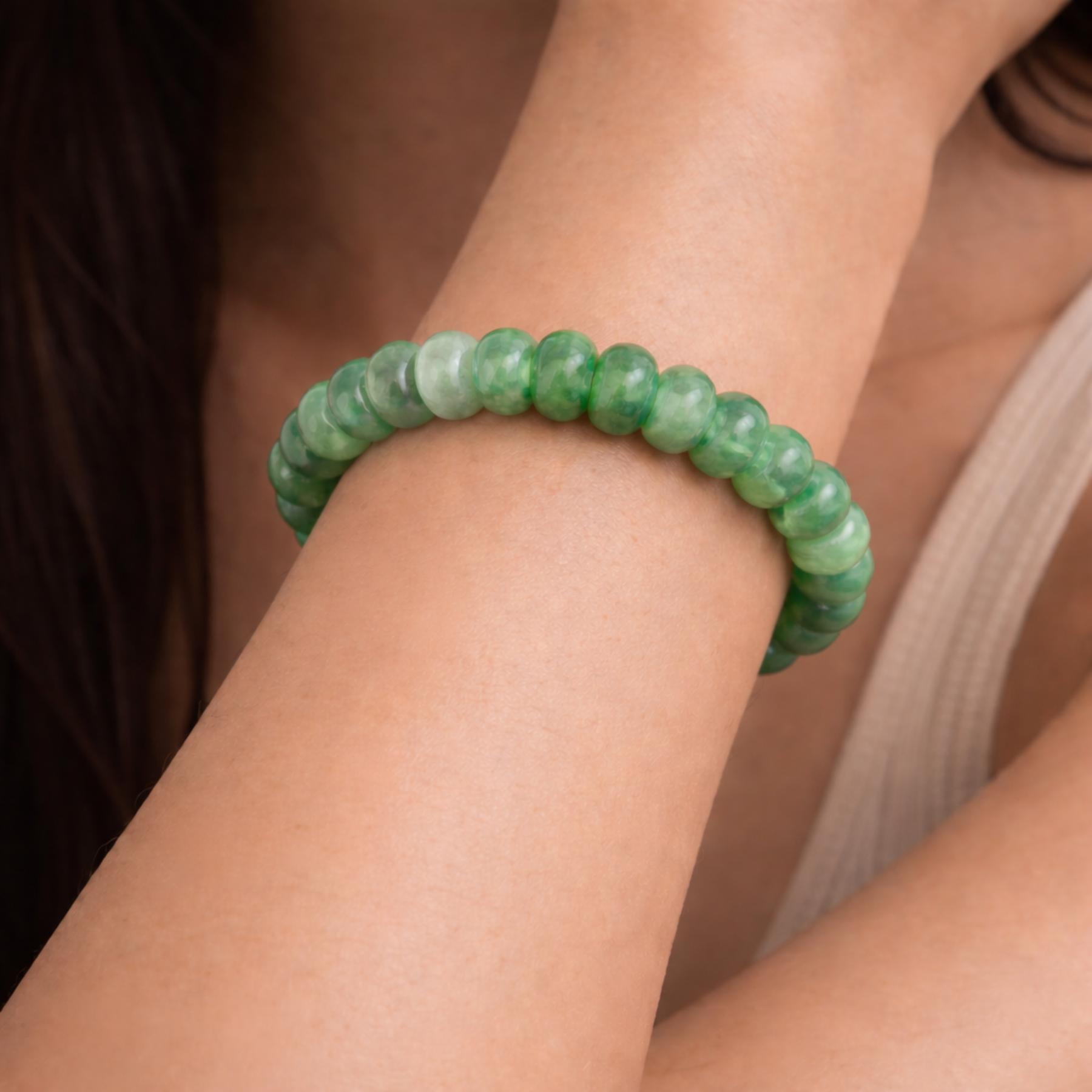 Close up of jade bead bracelet on wrist