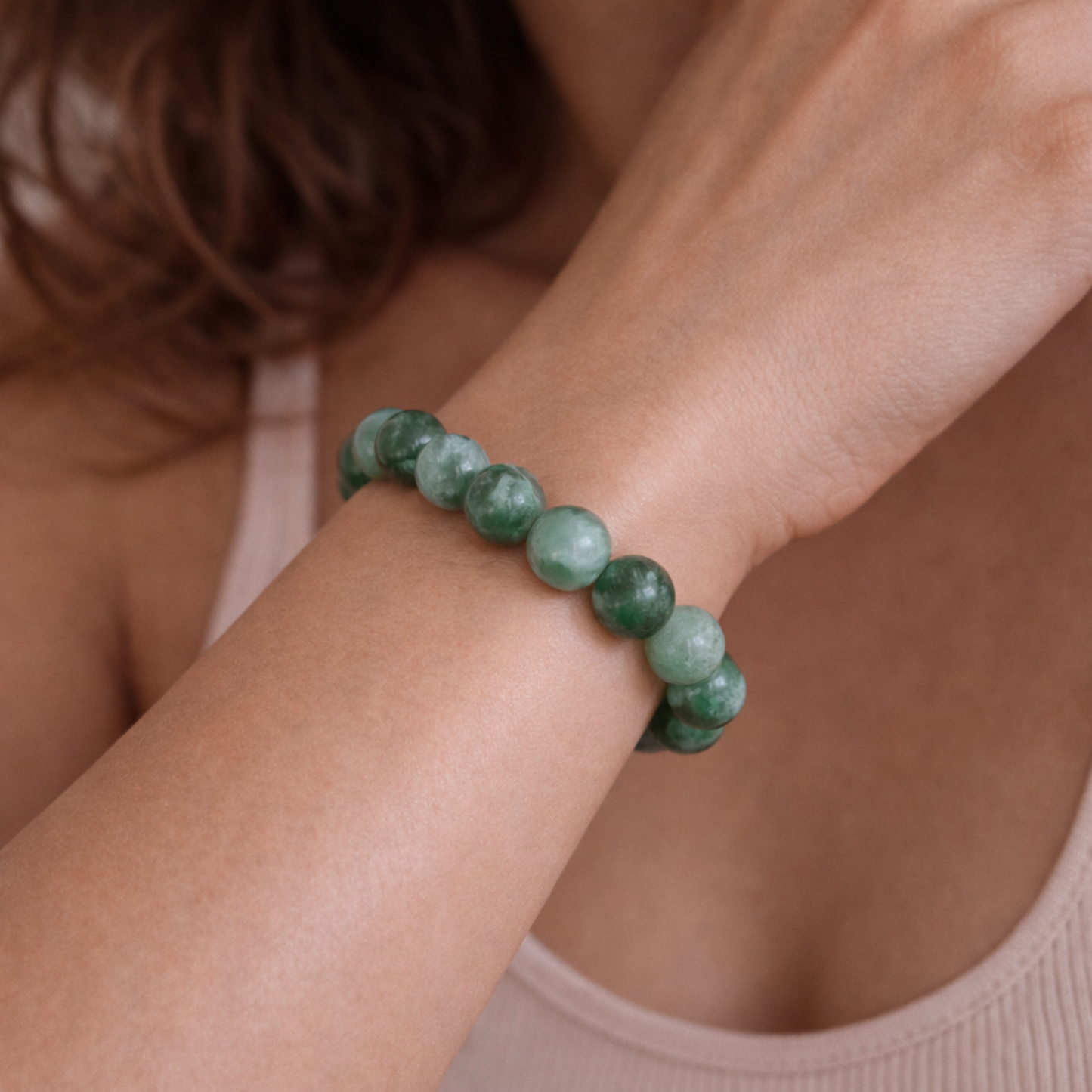 Close up of jadeite bead bracelet on wrist