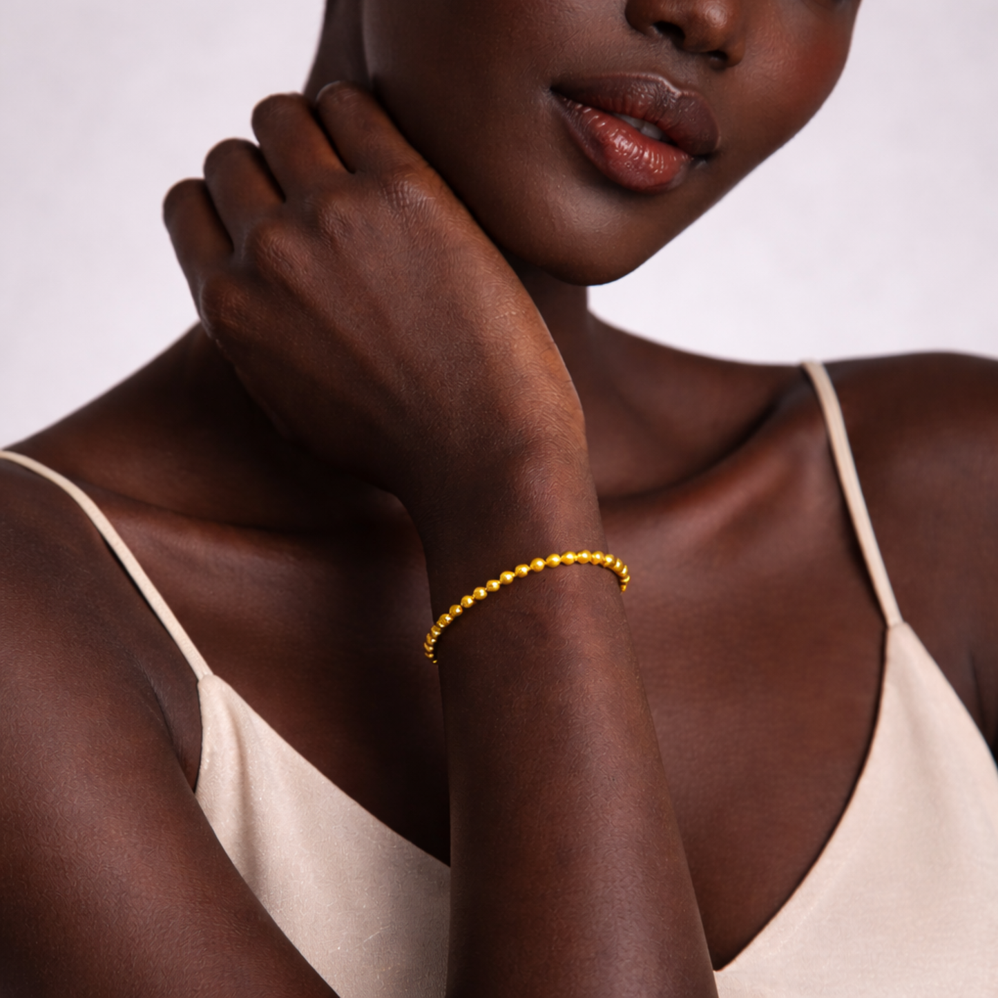 Close up of model wearing pyrite bead bracelet