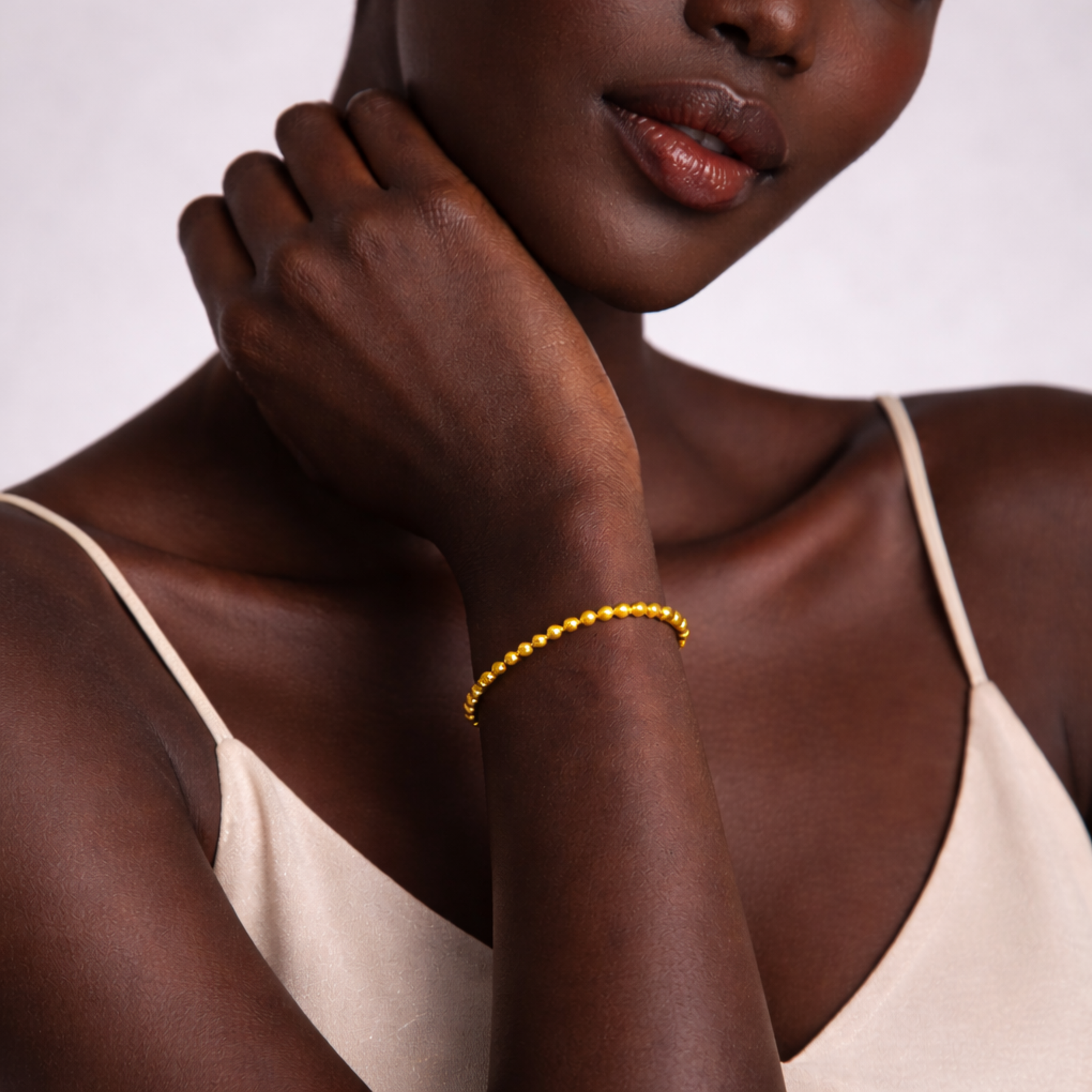 Close up of model wearing pyrite bead bracelet