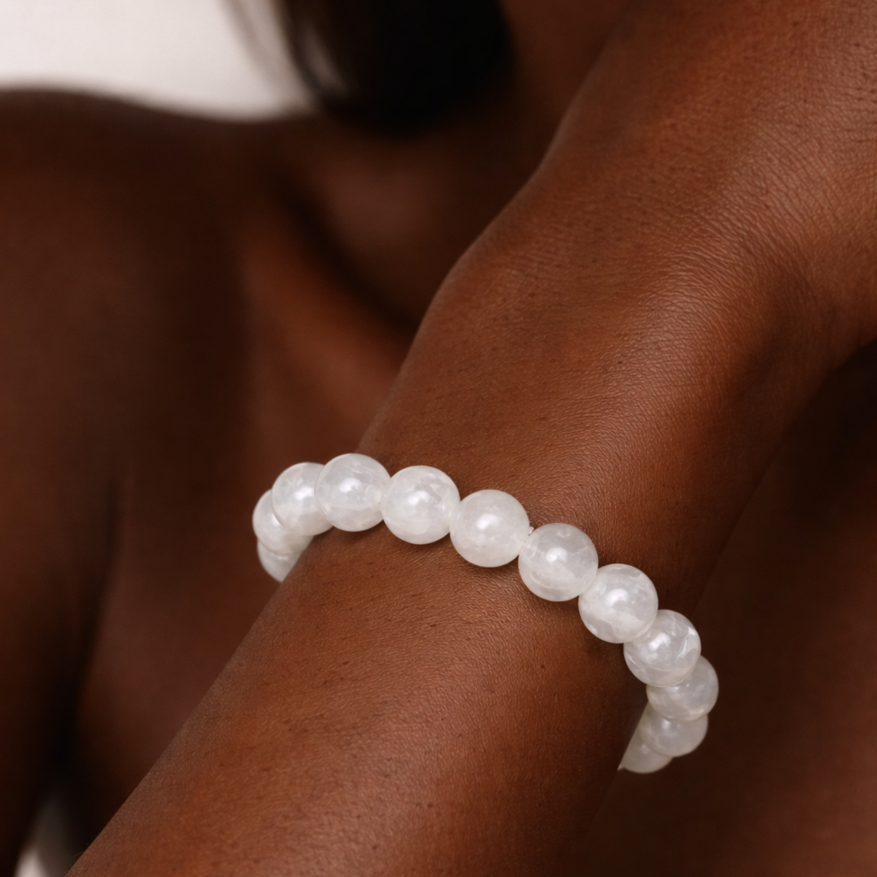 Close up of moonstone crystal bracelet worn on wrist
