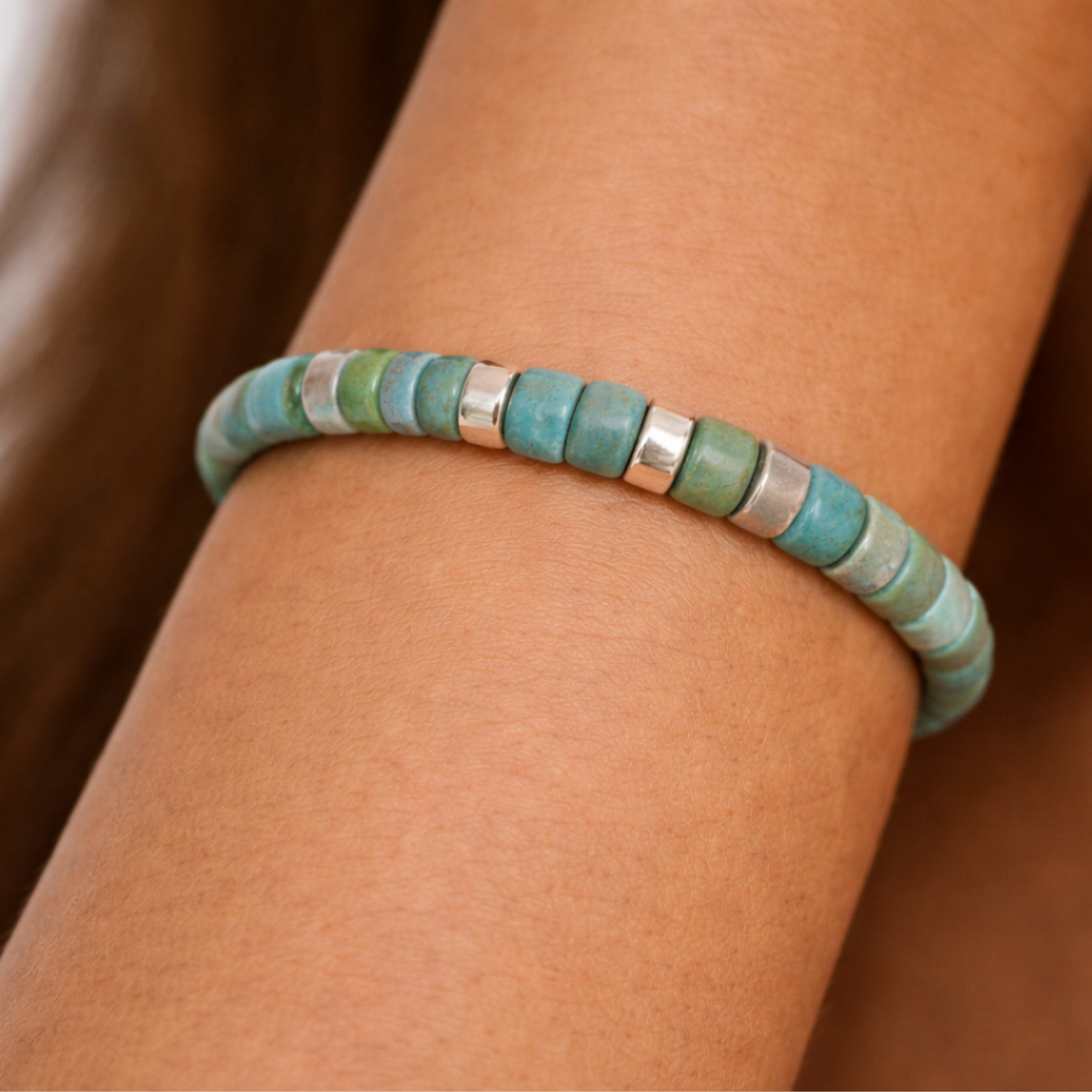 Close up of turquoise cord bracelet worn on wrist