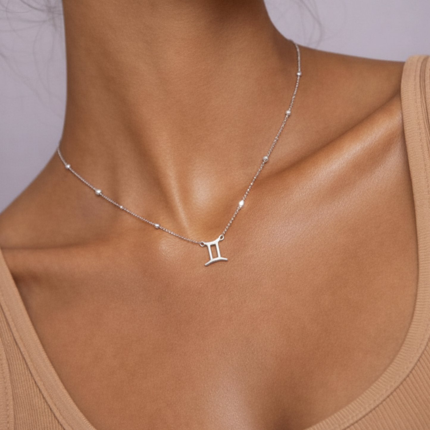 Gemini zodiac necklace silver close up showing zodiac symbol pendant