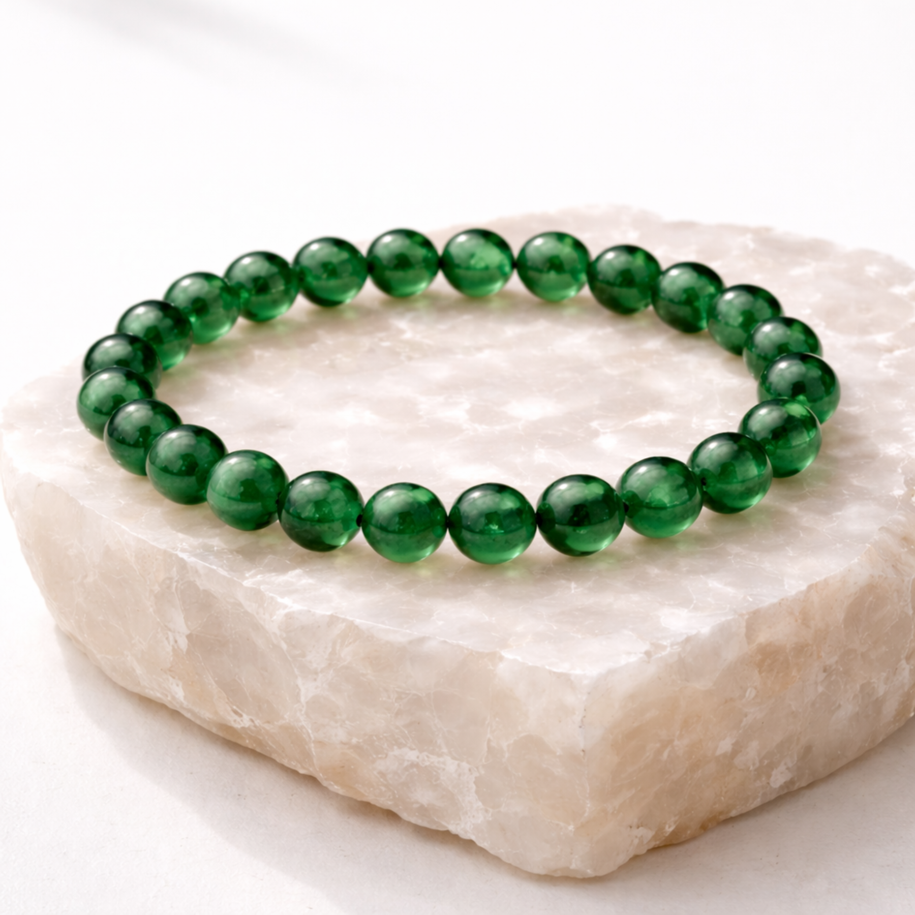 Jade crystal bead bracelet on stone base