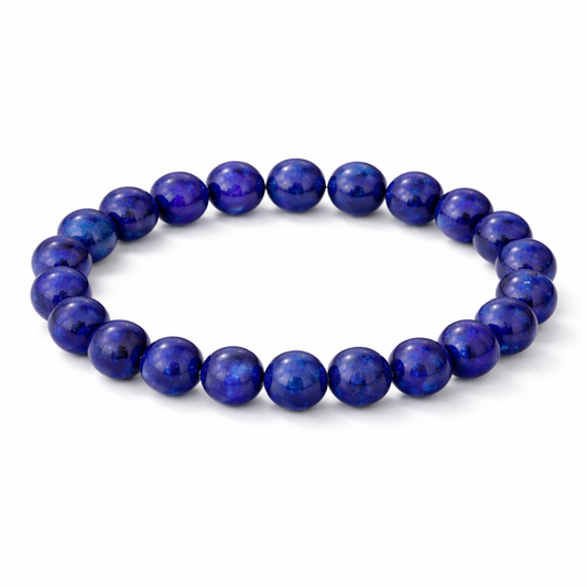 Lapis lazuli beaded bracelet isolated on white studio background deep blue polished round beads by Moon Sutras