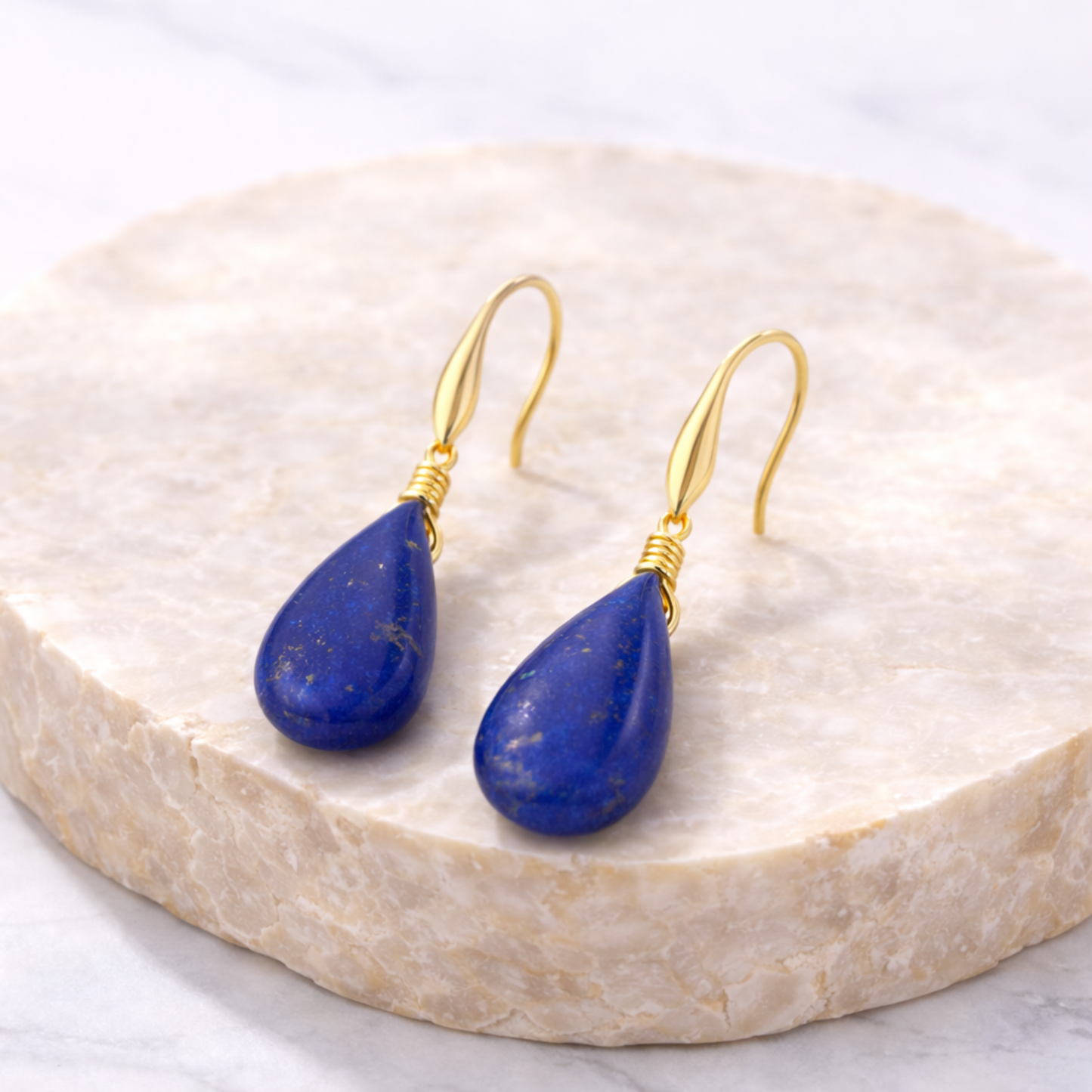Lapis lazuli earrings on stone display