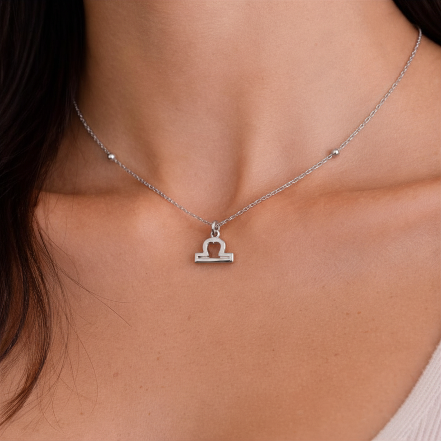 Libra zodiac necklace silver close up on model showing pendant