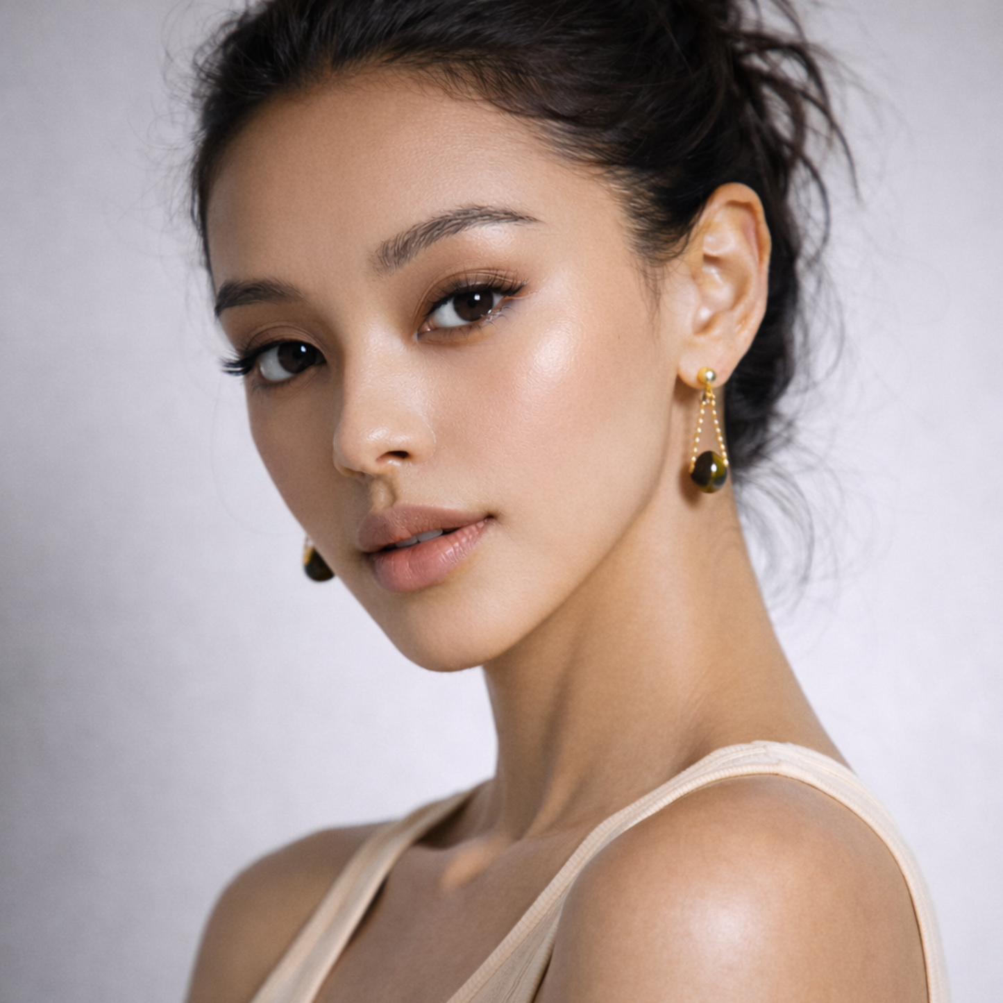 Model wearing Tiger’s Eye earrings