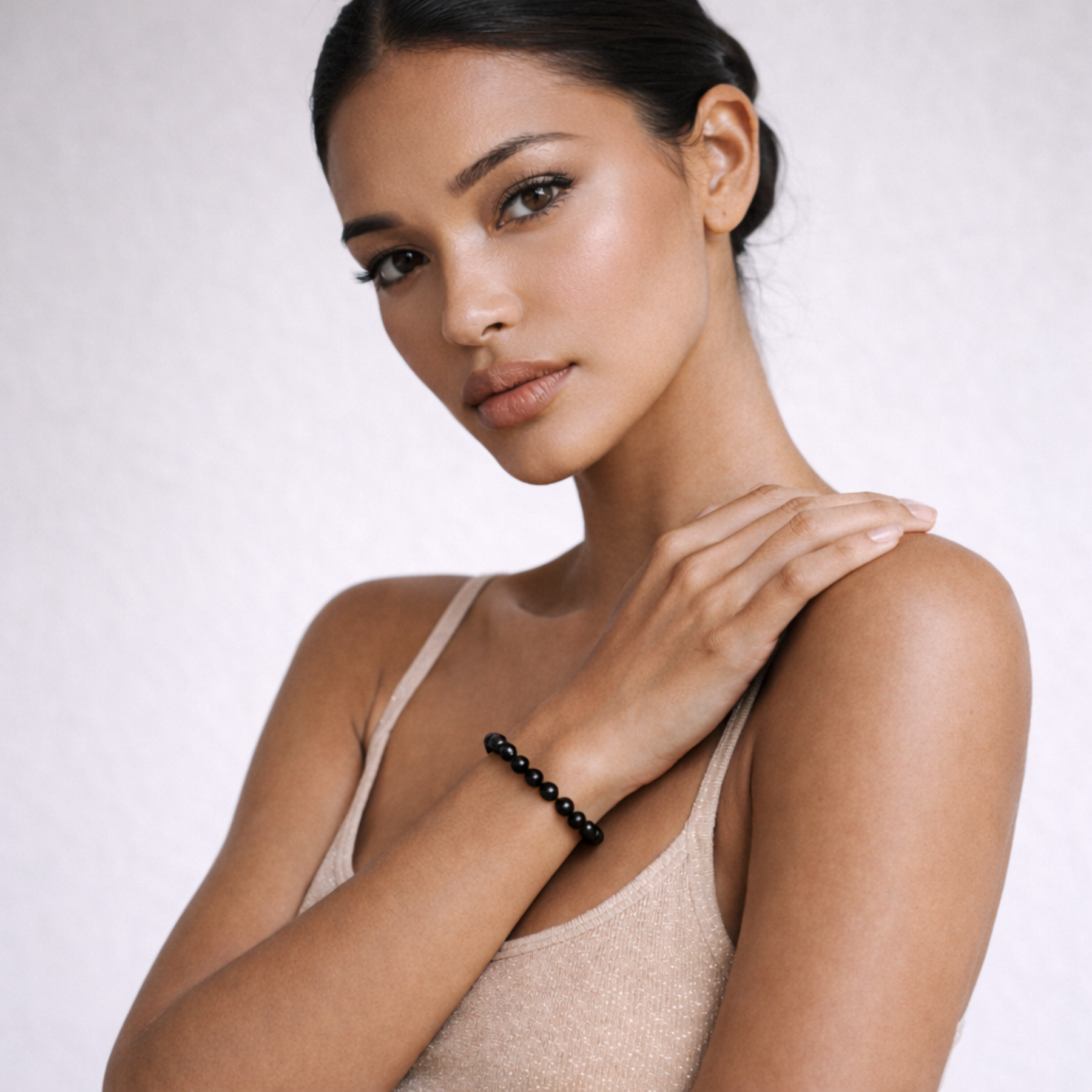 Model wearing black obsidian crystal bracelet