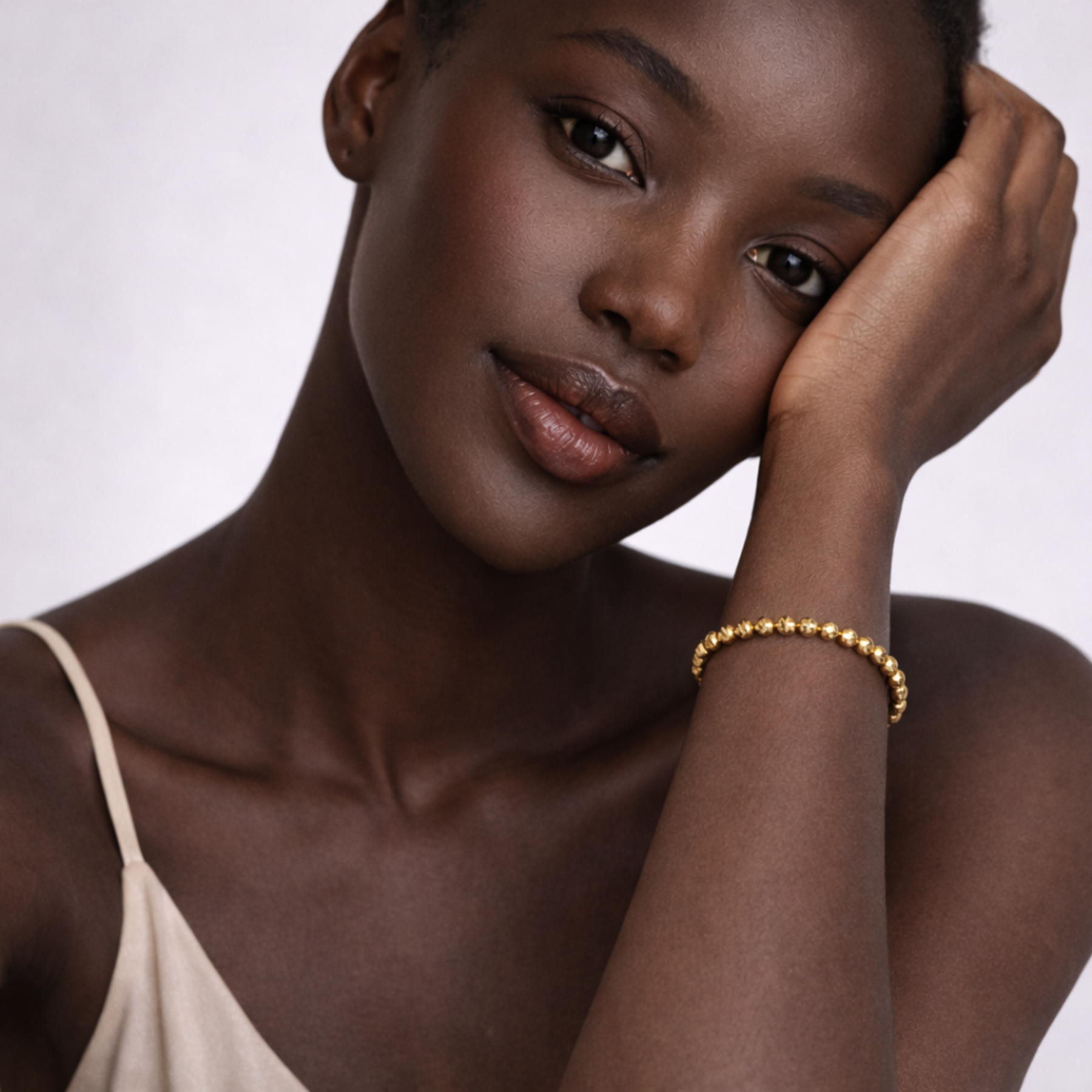 Model wearing gold pyrite bracelet on wrist