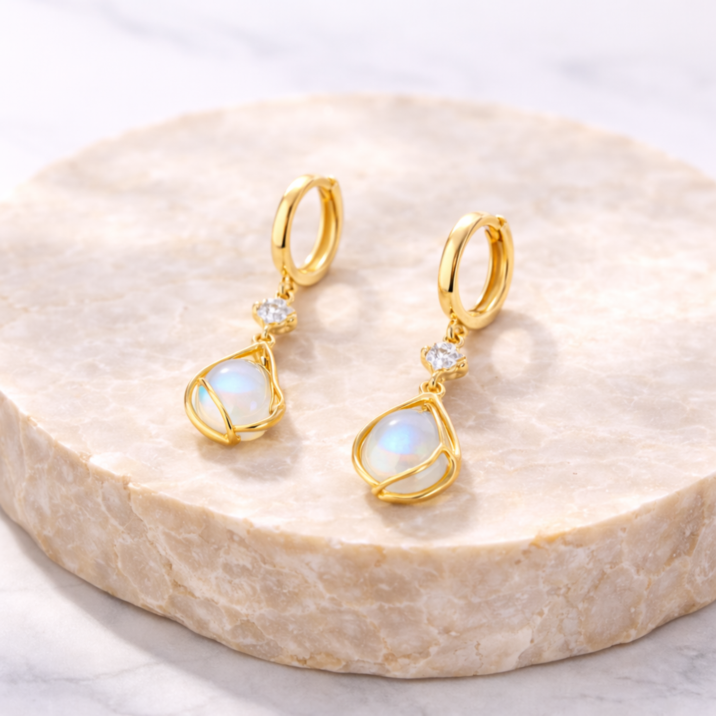 Moonstone earrings on natural stone 