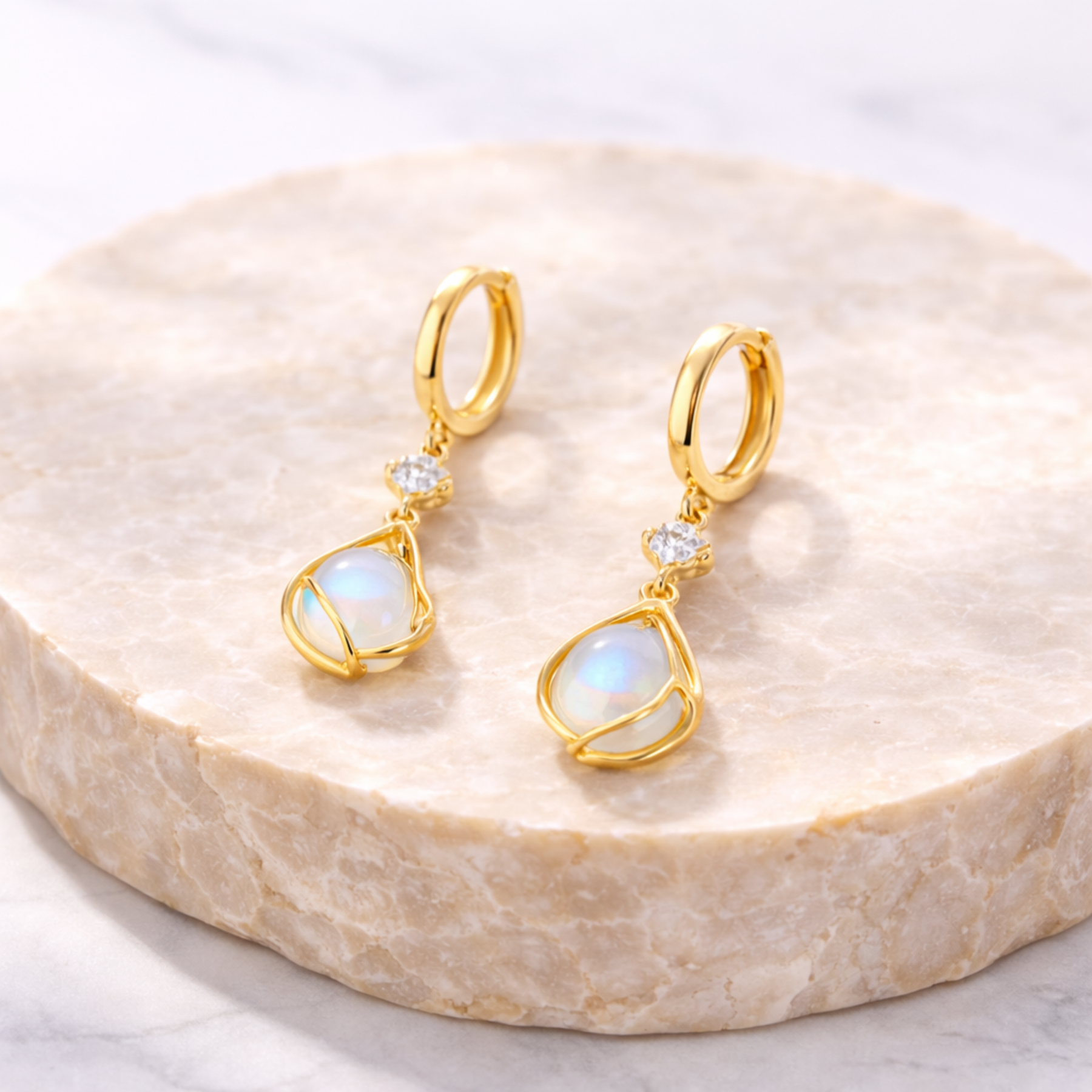 Moonstone earrings on natural stone 