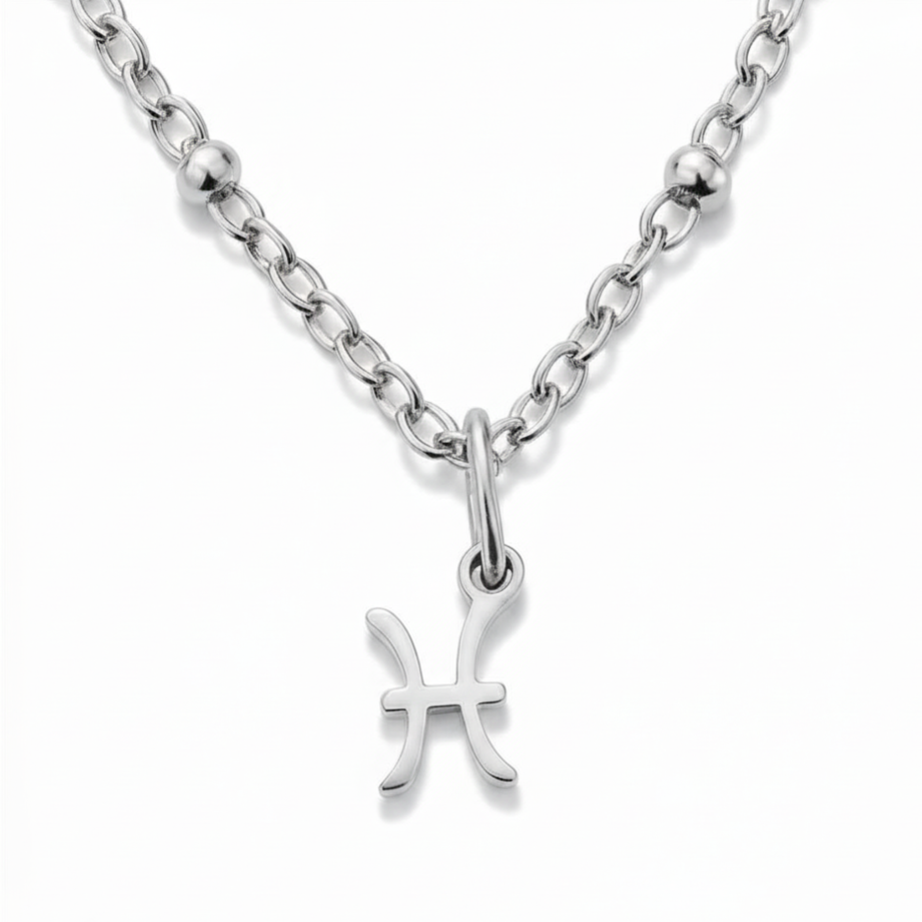 Pisces zodiac necklace silver pendant on silver chain close up