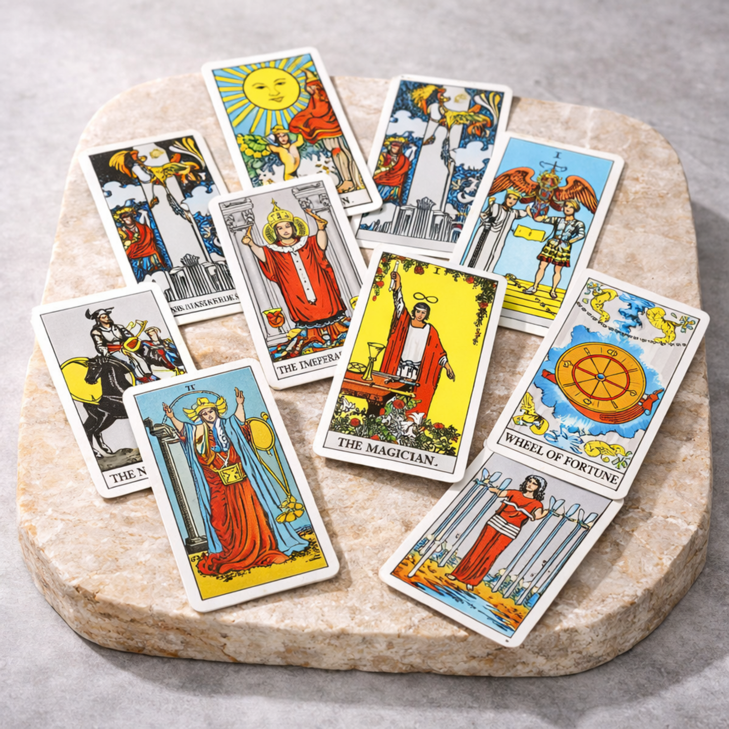 Rider Waite tarot cards spread on stone surface