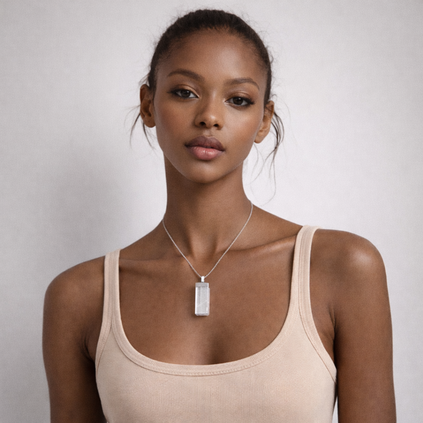 Selenite necklace worn on model portrait view with silver chain