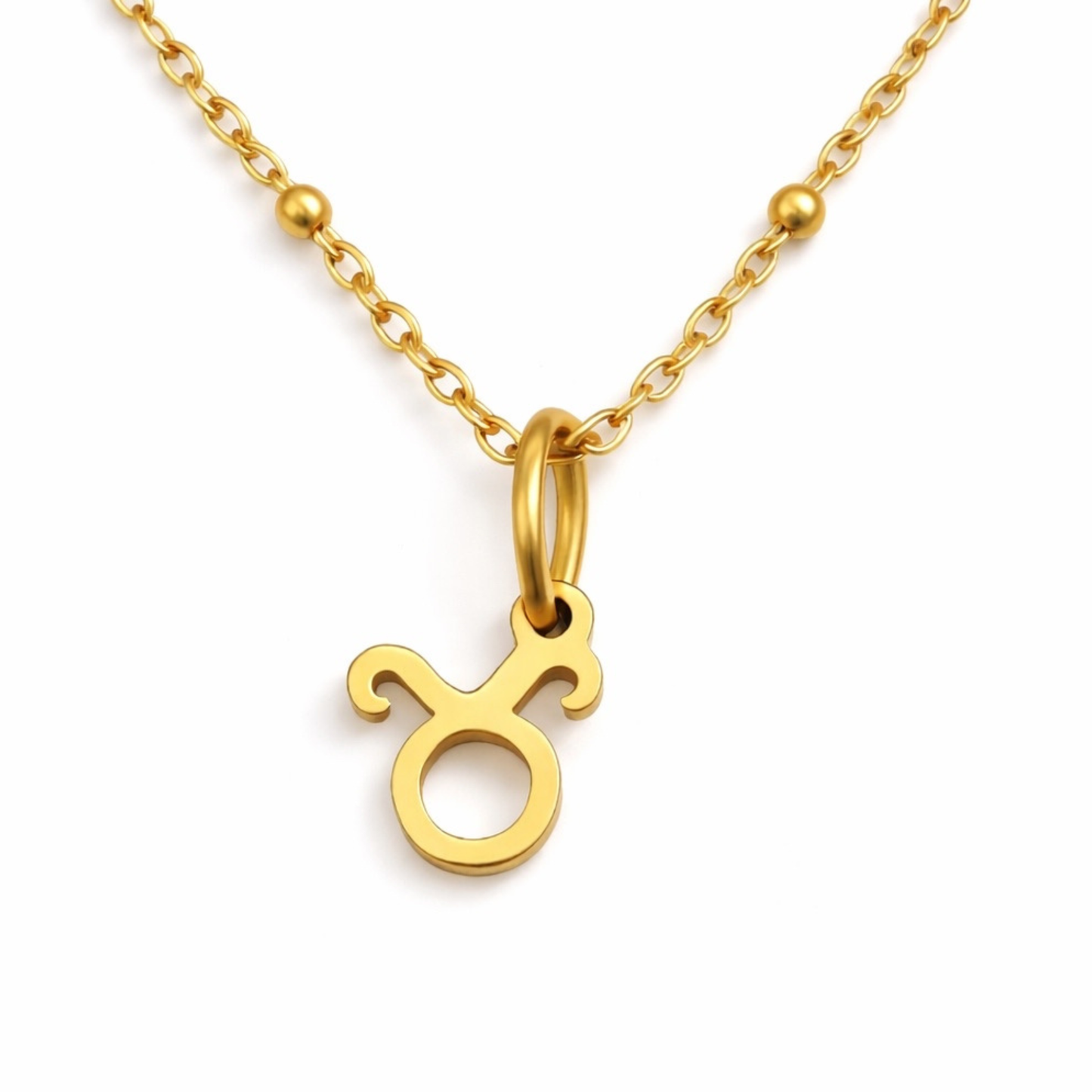 Taurus zodiac necklace gold pendant on gold chain close up by Moon Sutras
