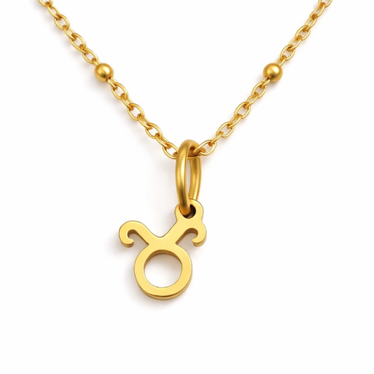 Taurus zodiac necklace gold pendant on gold chain close up by Moon Sutras