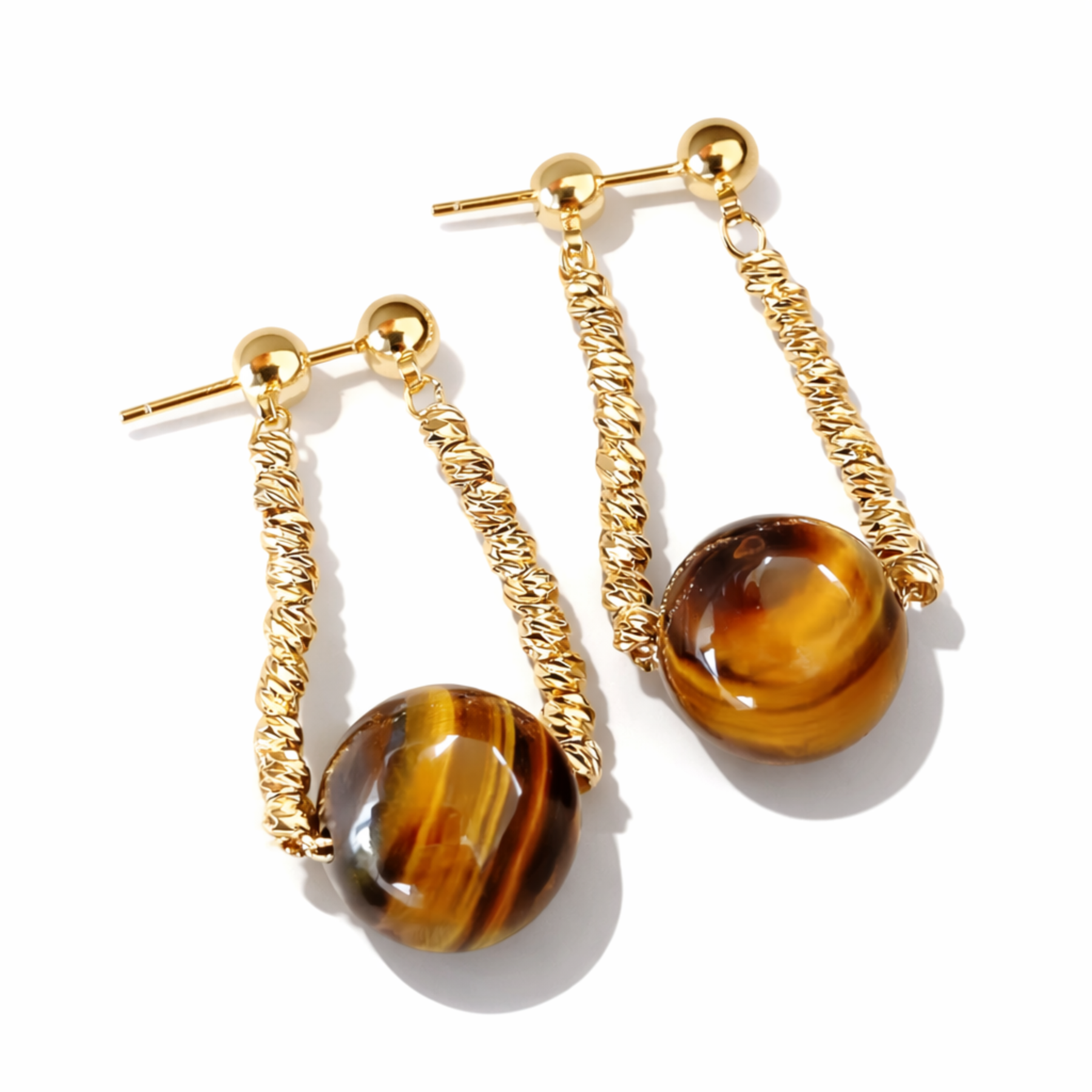 Tiger’s Eye earrings on white studio background