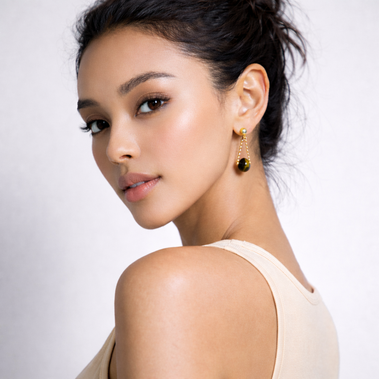 Tiger’s Eye earrings worn by a woman
