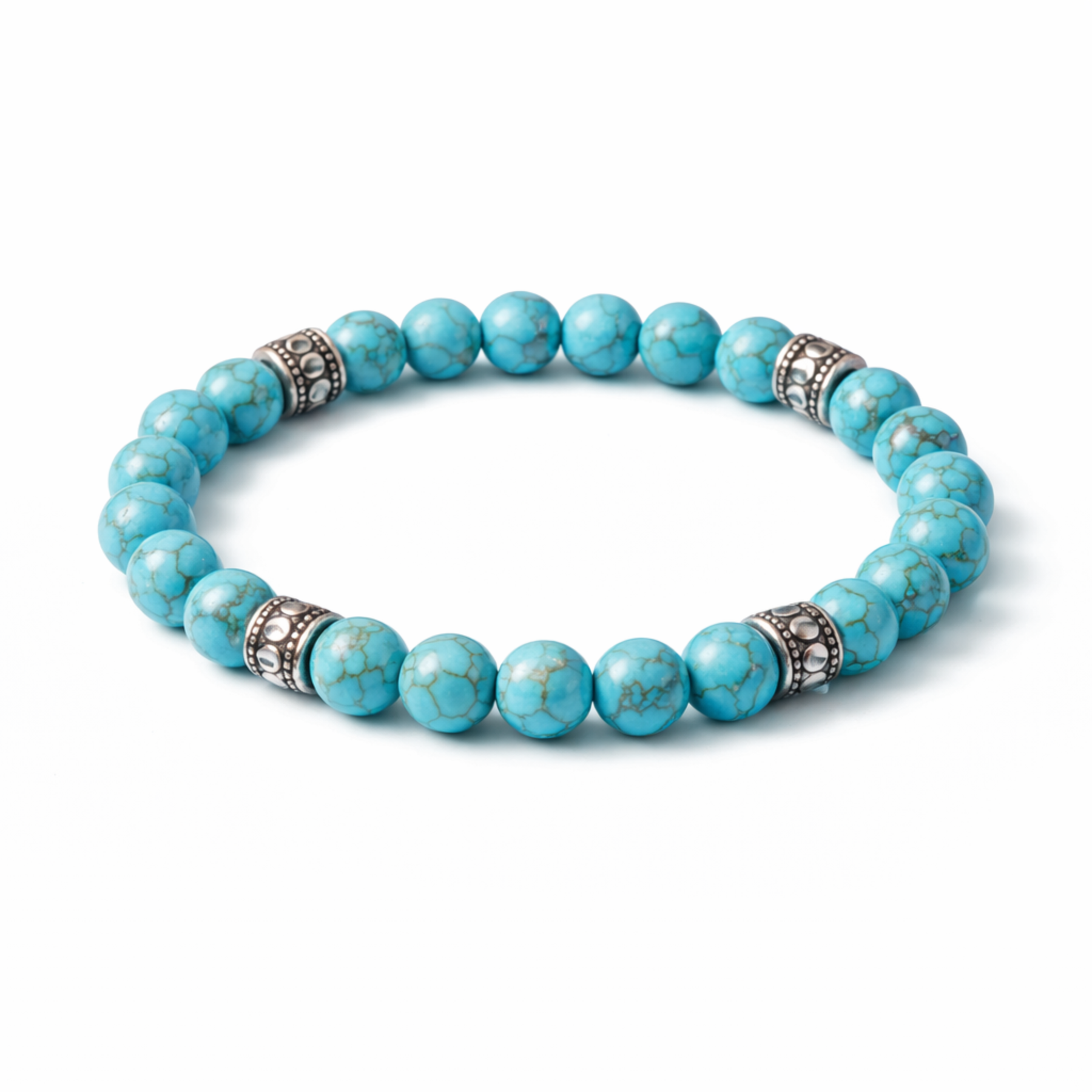 Turquoise bead bracelet with silver spacer beads on white background