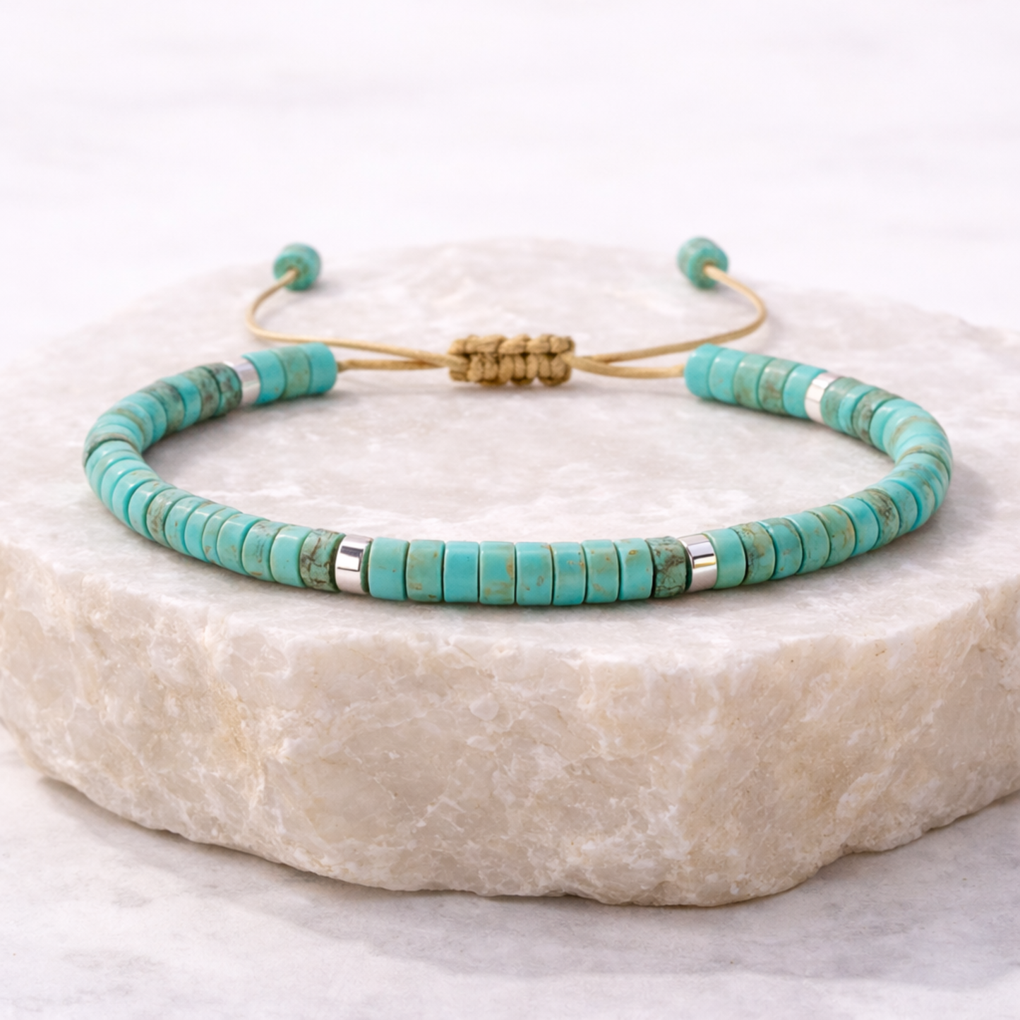Turquoise cord bead bracelet on stone base