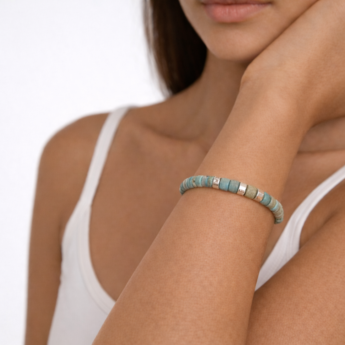 Turquoise cord bracelet with silver spacer beads