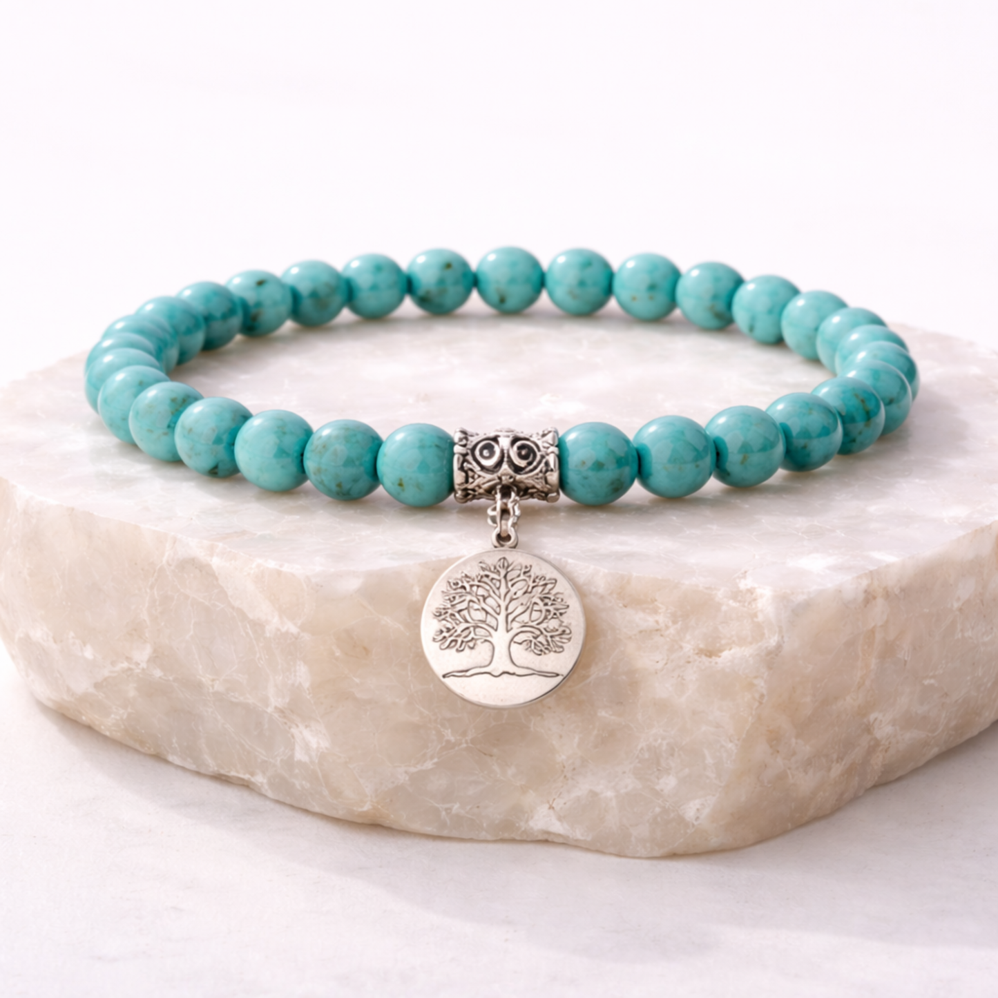 Turquoise crystal bead bracelet with tree of life charm on stone base