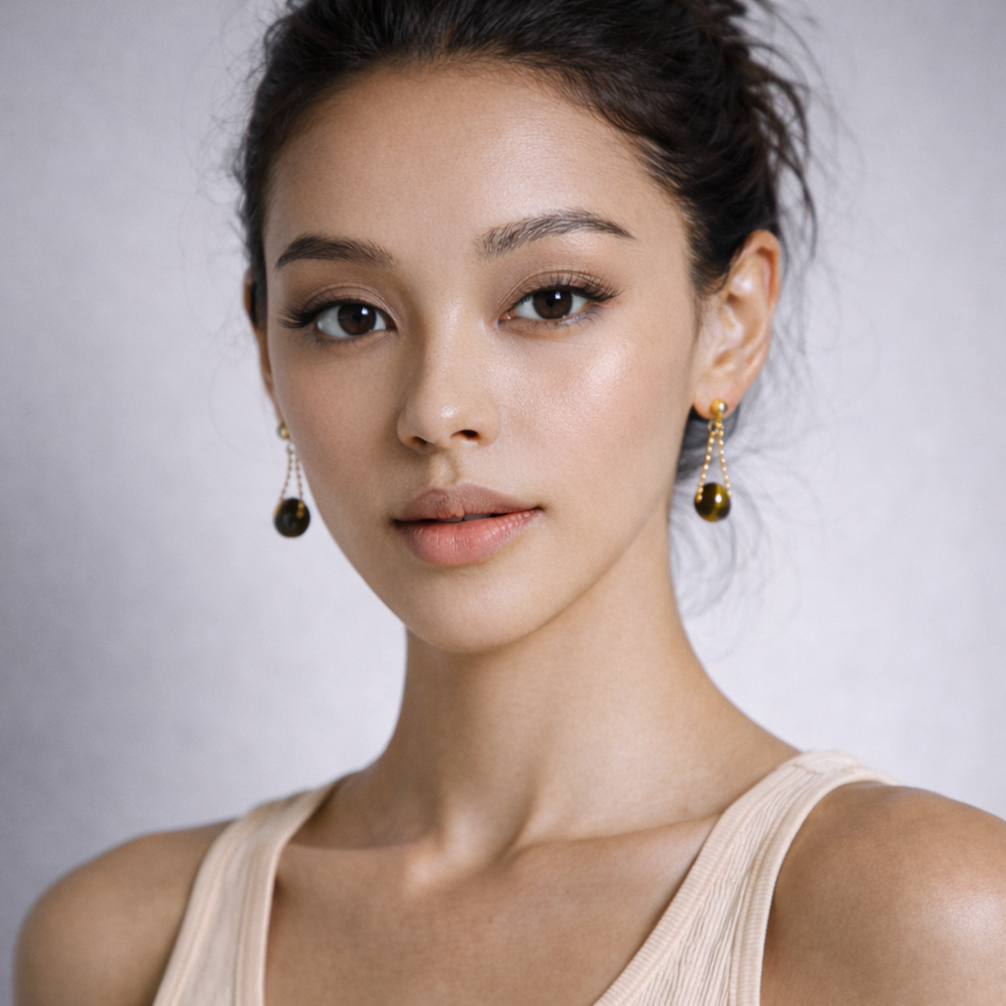Woman wearing Tiger’s Eye earrings