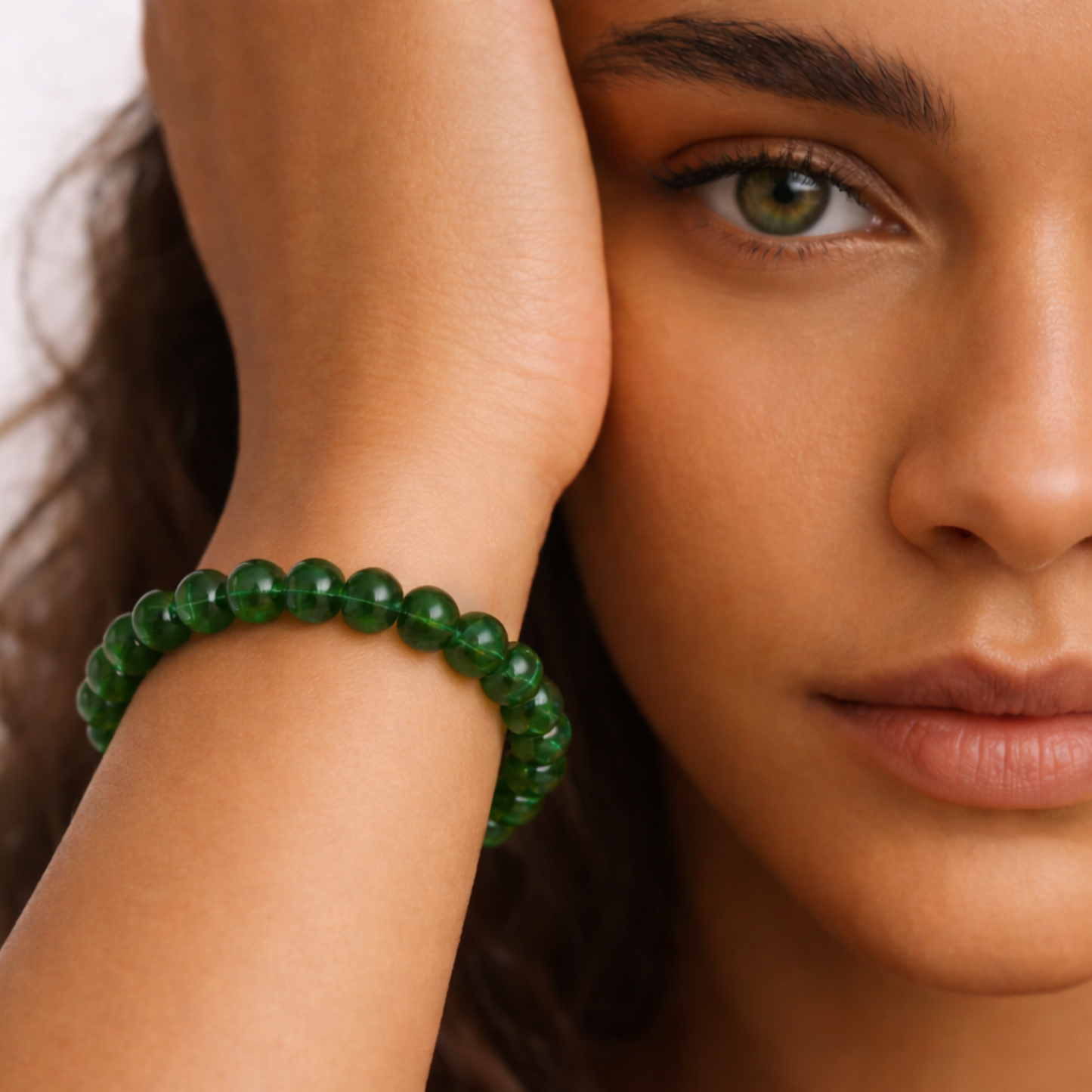Woman wearing jade crystal bracelet