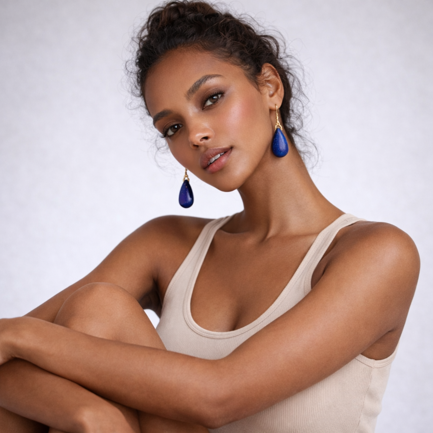 Woman wearing lapis lazuli earrings